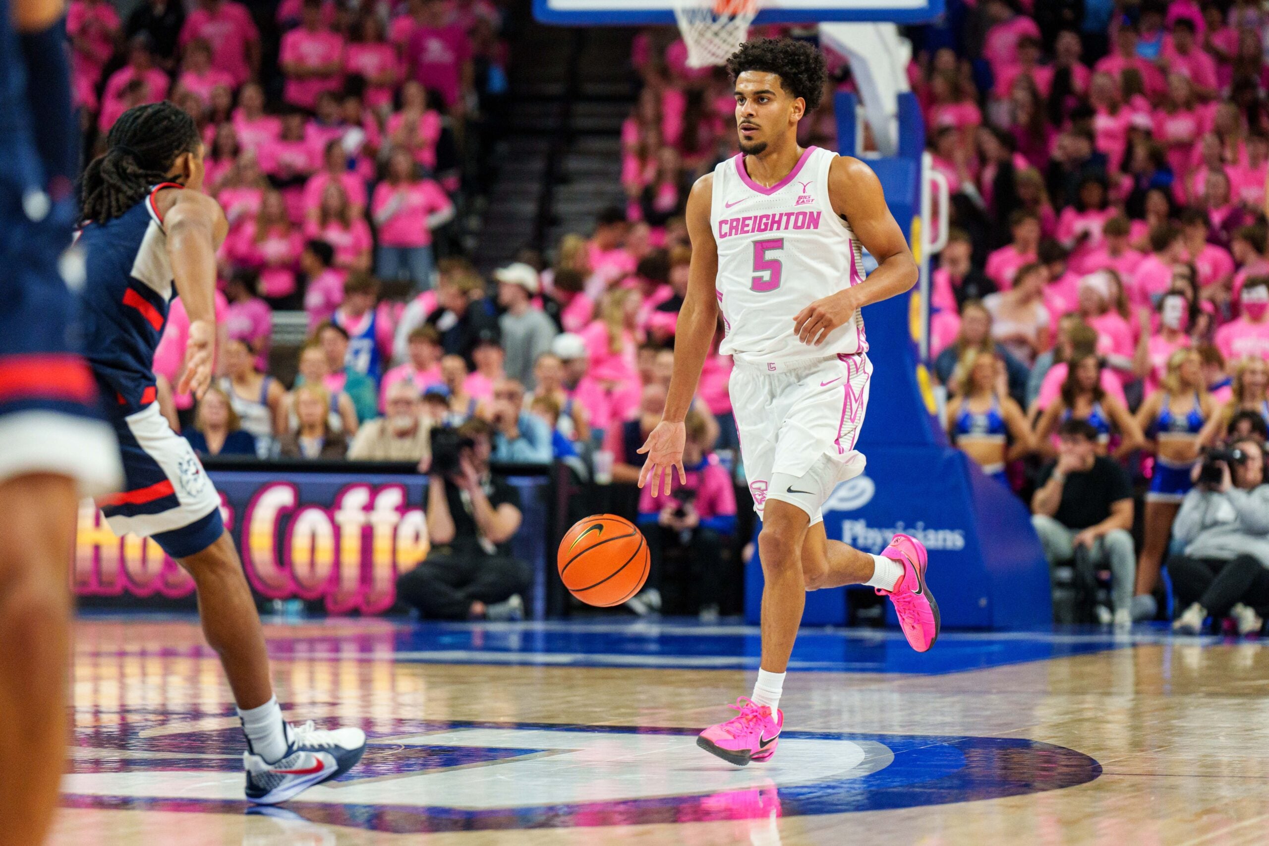 Jan 31, 2026; Omaha, Nebraska, USA; Creighton Bluejays guard Nik Graves (5) dribbles during the second half against the Connecticut Huskies at CHI Health Center Omaha. Mandatory Credit: Dylan Widger-Imagn Images
