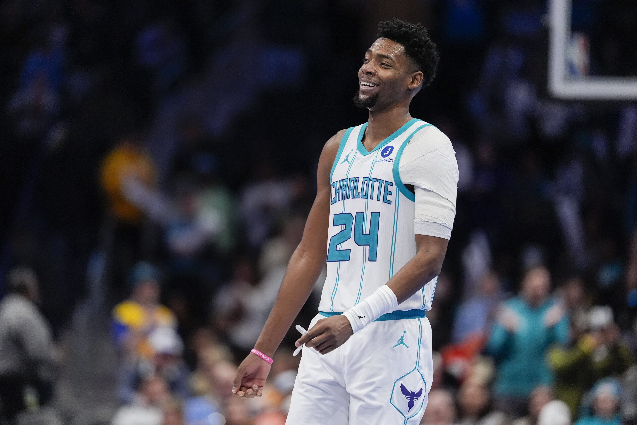 Feb 2, 2026; Charlotte, North Carolina, USA; Charlotte Hornets forward Brandon Miller (24) smiles in the final seconds of the come from behind win against the New Orleans Pelicans during the second half at the Spectrum Center. Mandatory Credit: Jim Dedmon-Imagn Images