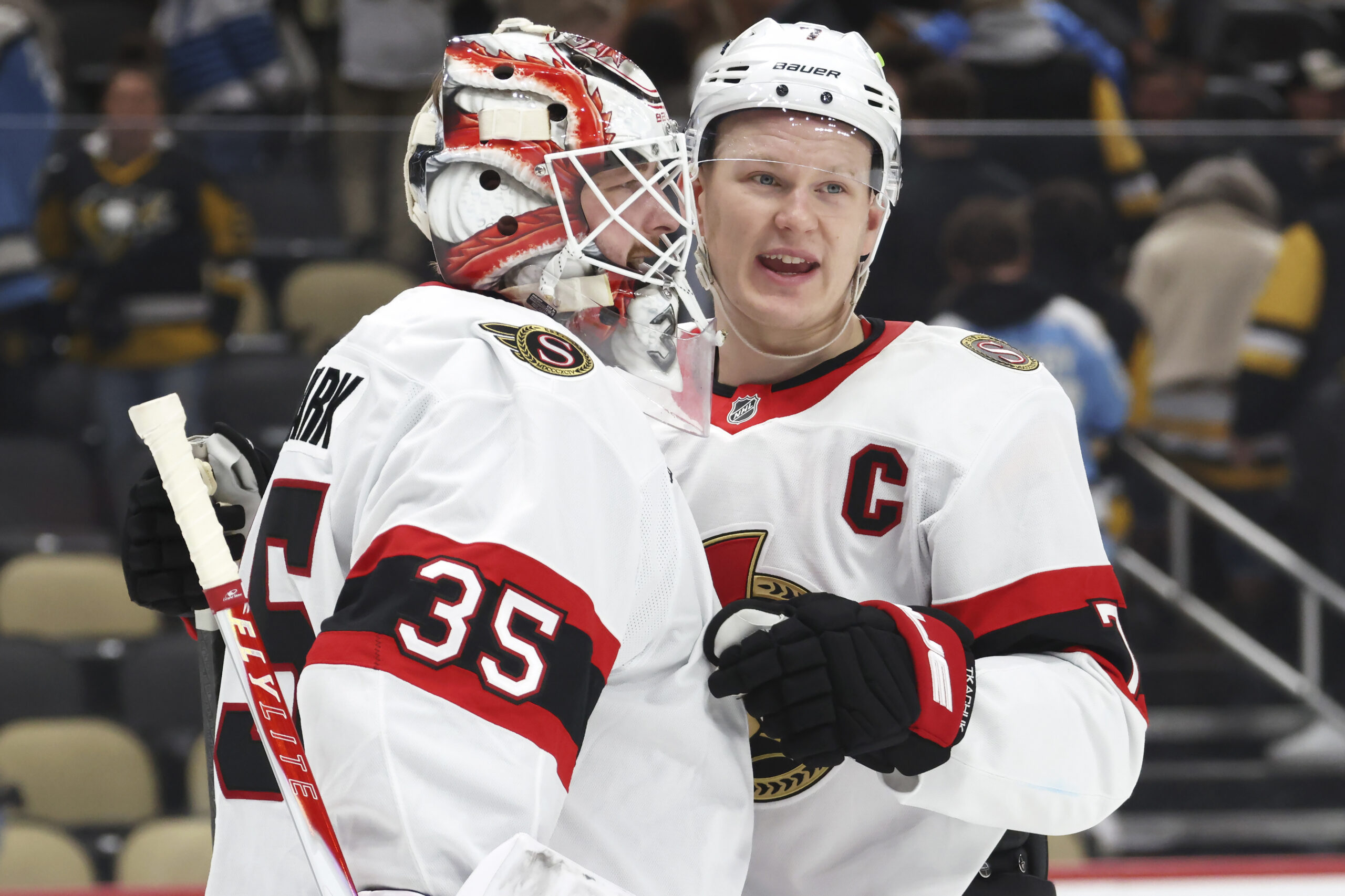 Feb 2, 2026; Pittsburgh, Pennsylvania, USA;  Ottawa Senators goaltender Linus Ullmark (35) and left wing Brady Tkachuk (7) celebrate a victory over the Pittsburgh Penguins at PPG Paints Arena. Mandatory Credit: Charles LeClaire-Imagn Images