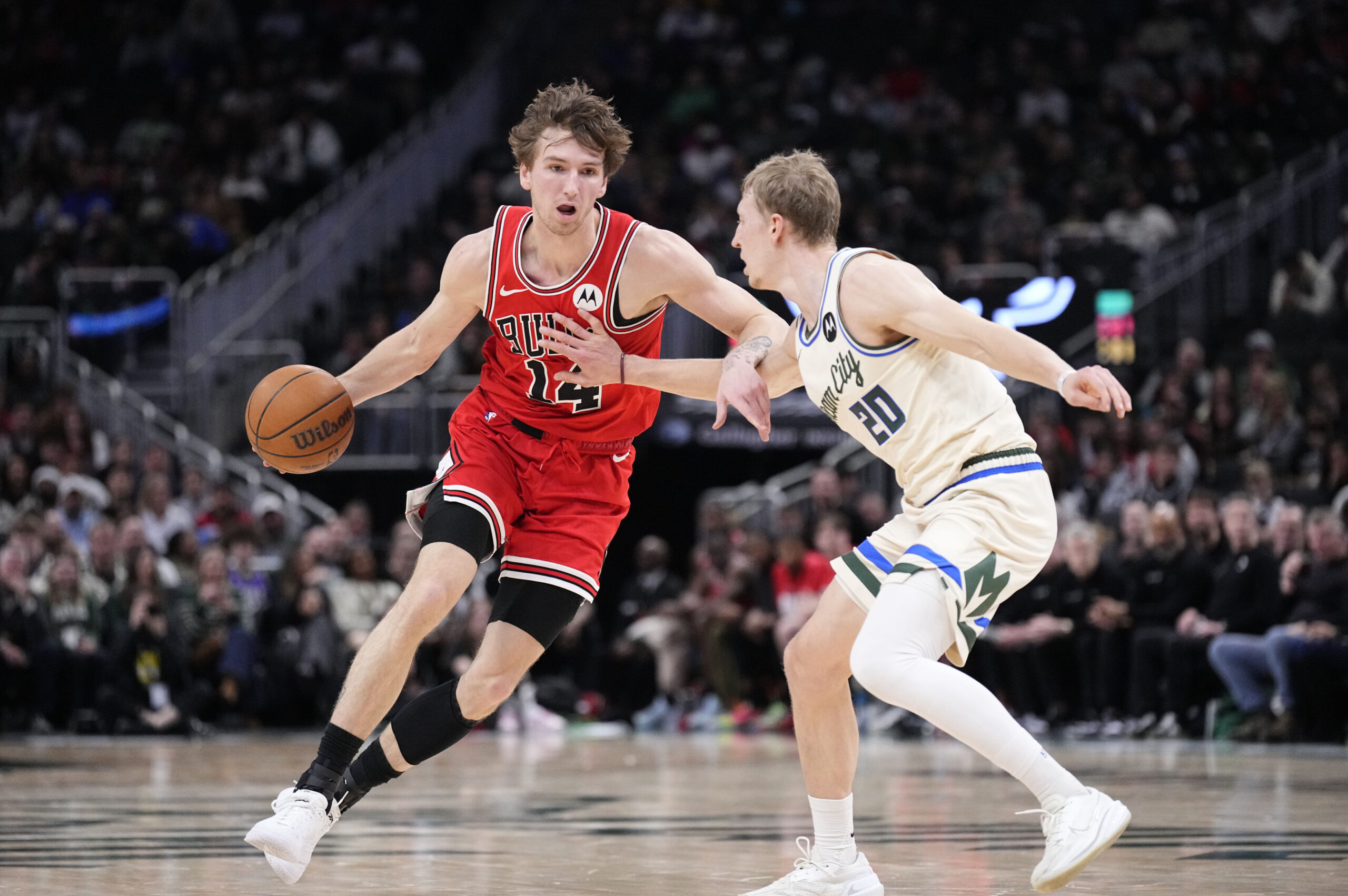 Feb 3, 2026; Milwaukee, Wisconsin, USA; Chicago Bulls forward Matas Buzelis (14) drives to the basket against Milwaukee Bucks guard AJ Green (20) in the first half at Fiserv Forum. Mandatory Credit: Michael McLoone-Imagn Images