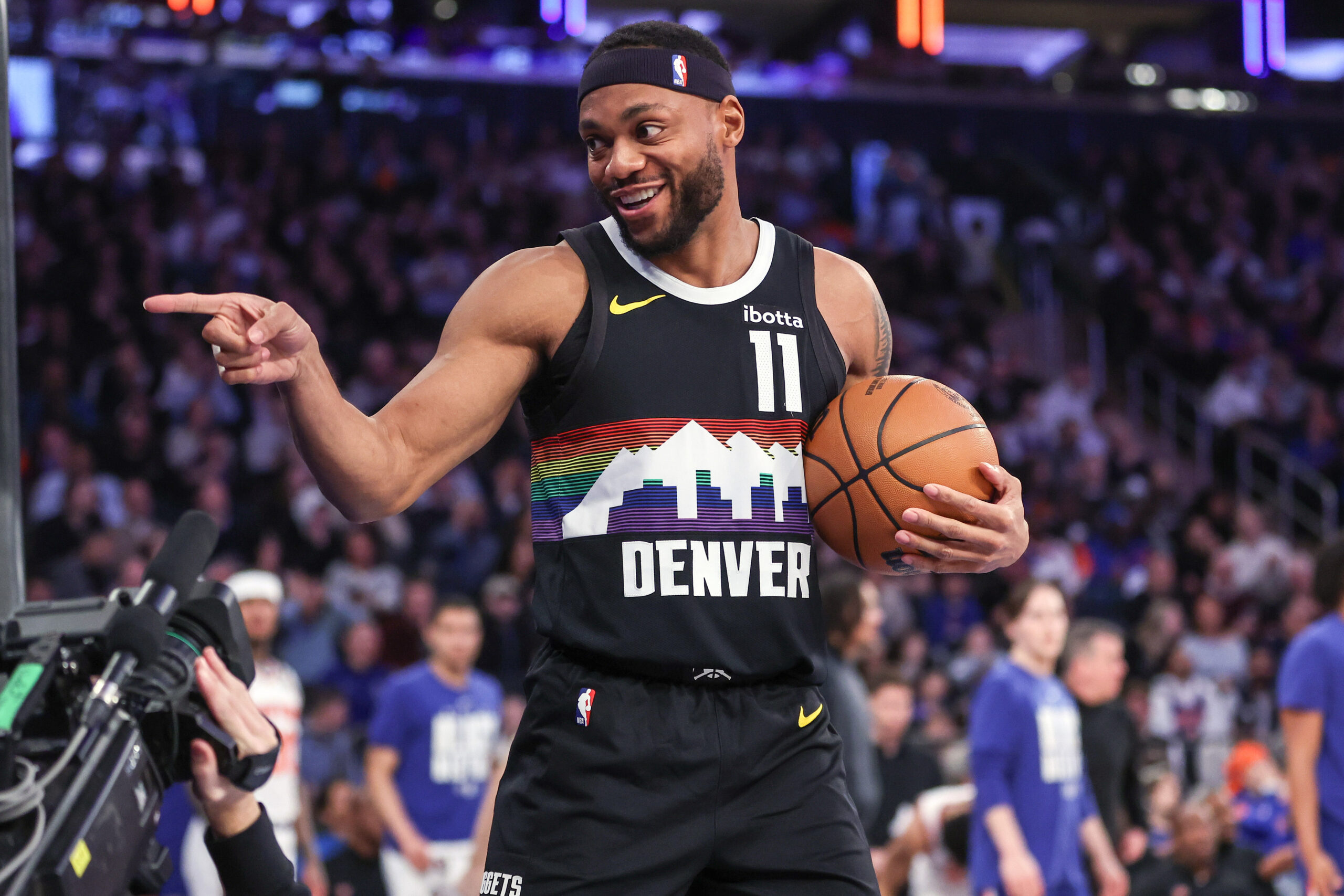 Feb 4, 2026; New York, New York, USA; Denver Nuggets guard Bruce Brown (11) points to a fan after making a jump shot at the buzzer to end the first quarter against the New York Knicks at Madison Square Garden. Mandatory Credit: Wendell Cruz-Imagn Images