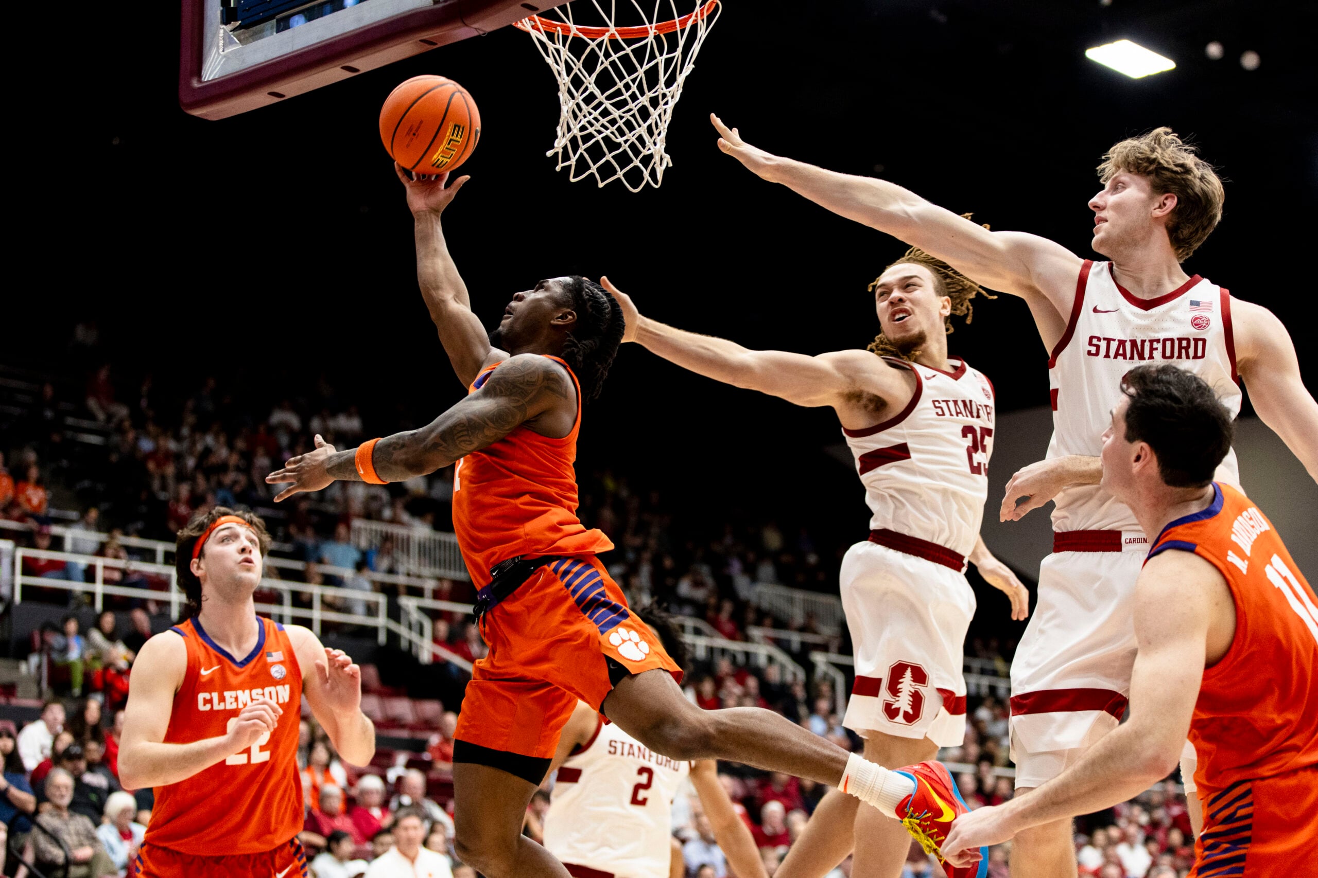 Feb 4, 2026; Stanford, California, USA; Clemson Tigers guard Jestin Porter (1) shoots against Stanford Cardinal guard Jeremy Dent-Smith (25) during the second half at Maples Pavilion. Mandatory Credit: John Hefti-Imagn Images
