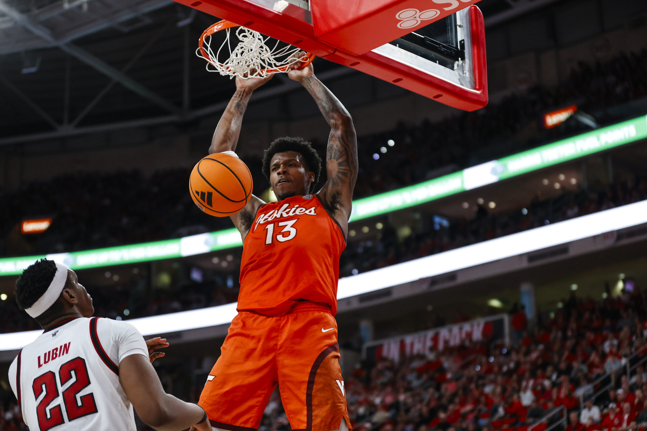 Feb 7, 2026; Raleigh, North Carolina, USA; Virginia Tech Hokies forward Amani Hansberry (13) dunks the ball during the second half of the game against the NC State Wolfpack at Lenovo Center. Mandatory Credit: Jaylynn Nash-Imagn Images