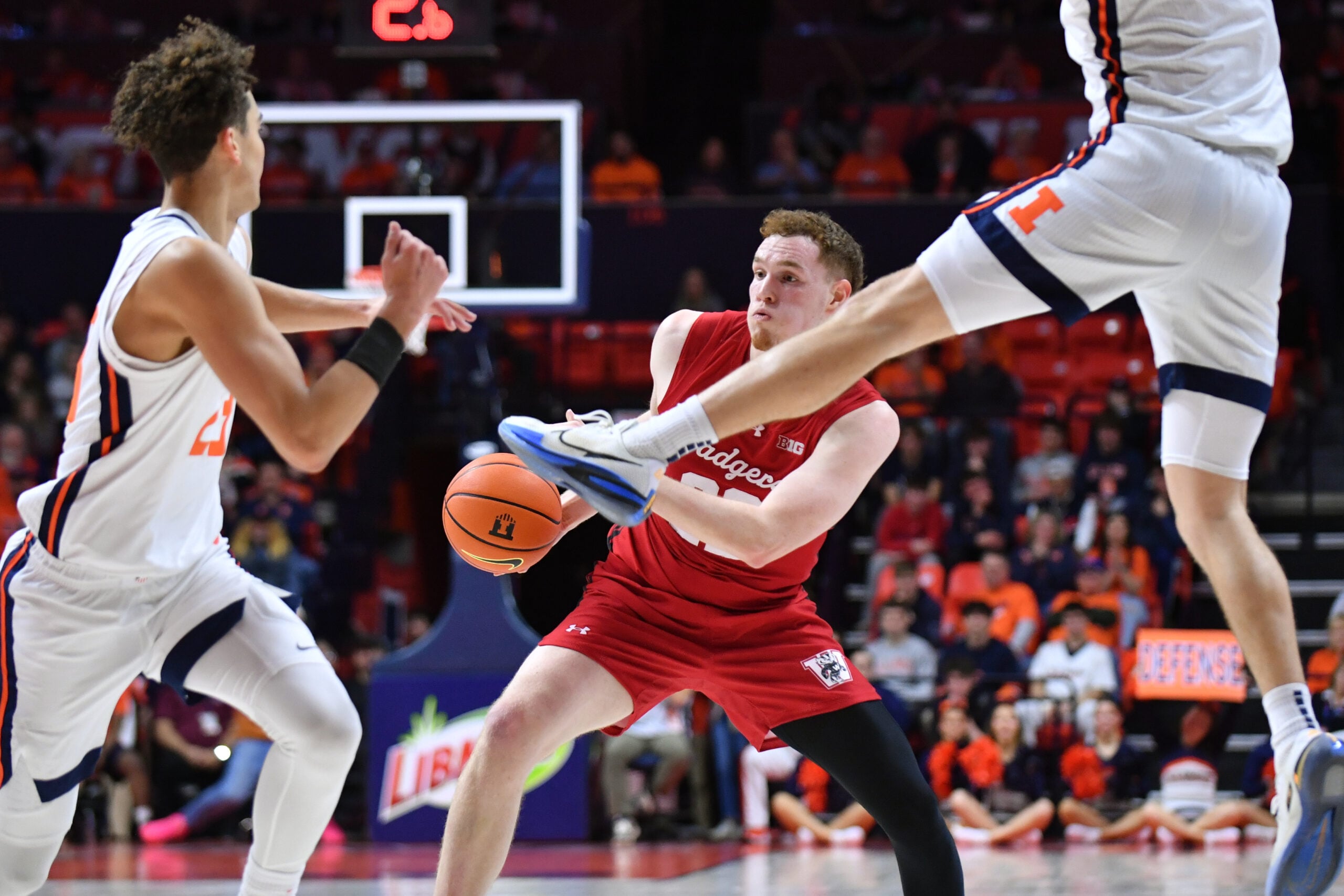 Feb 10, 2026; Champaign, Illinois, USA;  Wisconsin Badgers forward Austin Rapp (22) drives the ball during the second half against the Wisconsin Badgers at State Farm Center. Mandatory Credit: Ron Johnson-Imagn Images