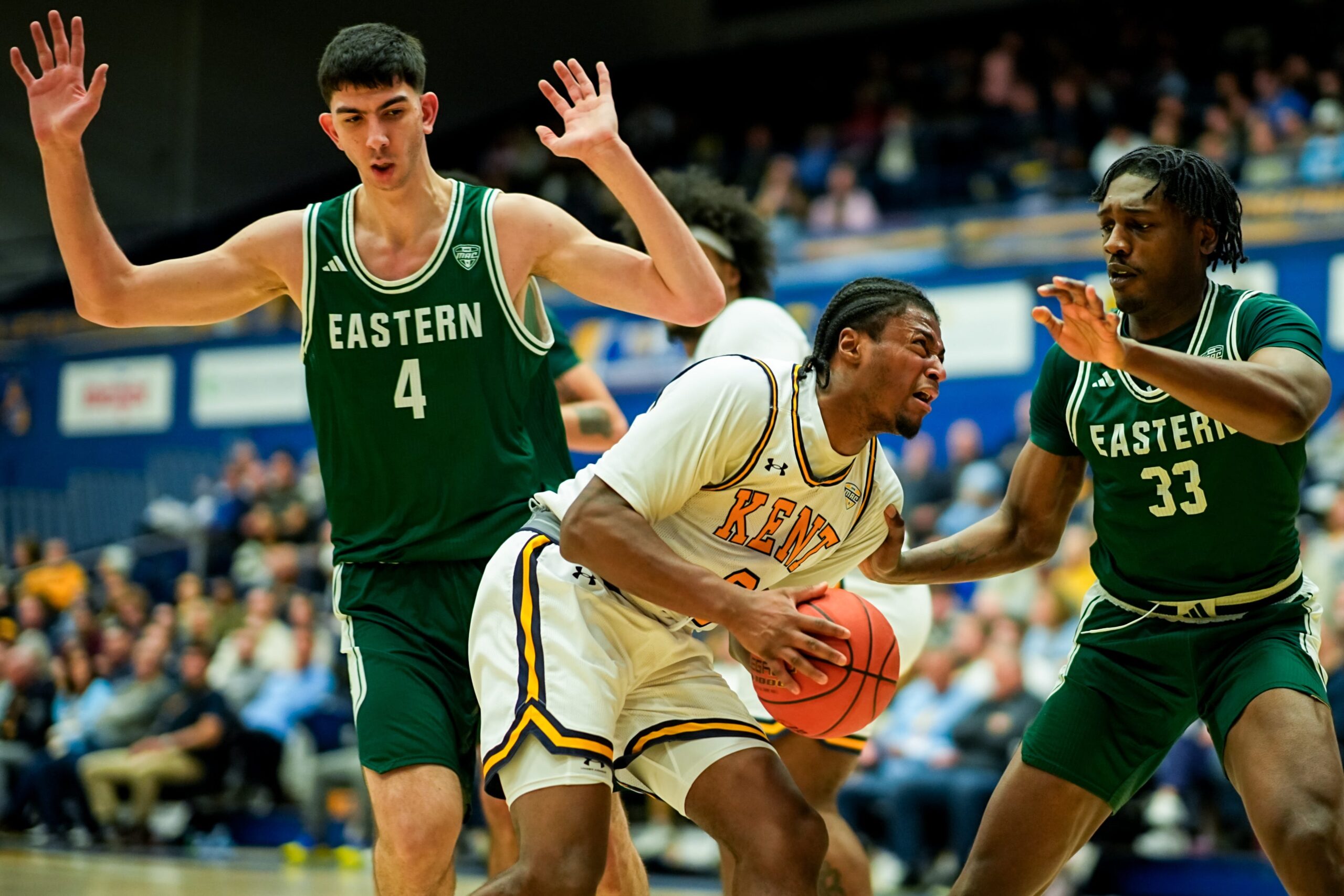 Kent State University’s Morgan Safford (8) looks to shoot while guarded by Eastern Michigan University’s Mohammad Habhab (4) and Eastern Michigan University’s John Shanu II (33), Feb. 11, 2026, at M.A.C. Center in Kent, Ohio.
