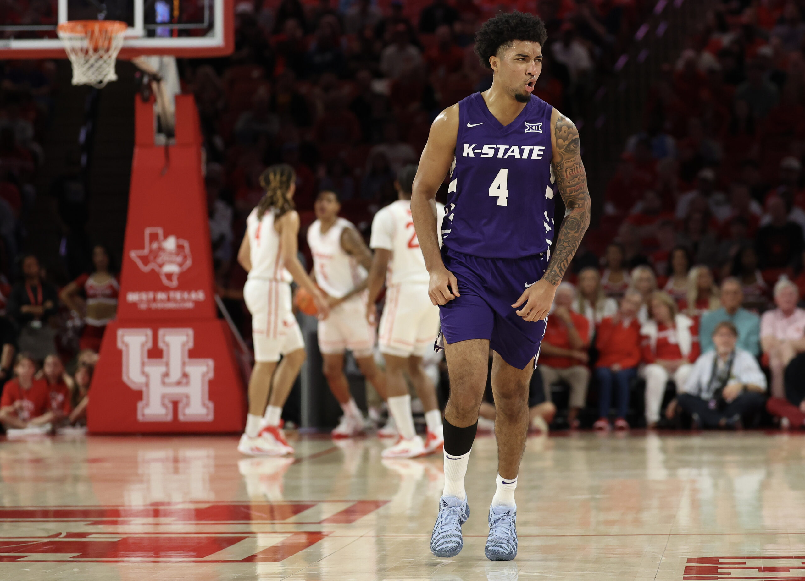 Feb 14, 2026; Houston, Texas, USA;  Kansas State Wildcats guard PJ Haggerty (4) celebrates his three point basket against the Houston Cougars in the first half at Fertitta Center. Mandatory Credit: Thomas Shea-Imagn Images
