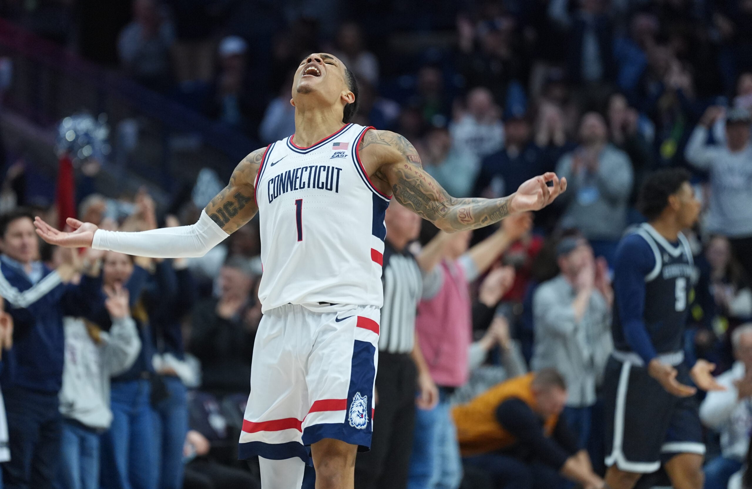 Feb 14, 2026; Storrs, Connecticut, USA; UConn Huskies guard Solo Ball (1) reacts after his three point basket against the Georgetown Hoyas in the second half at Harry A. Gampel Pavilion. Mandatory Credit: David Butler II-Imagn Images