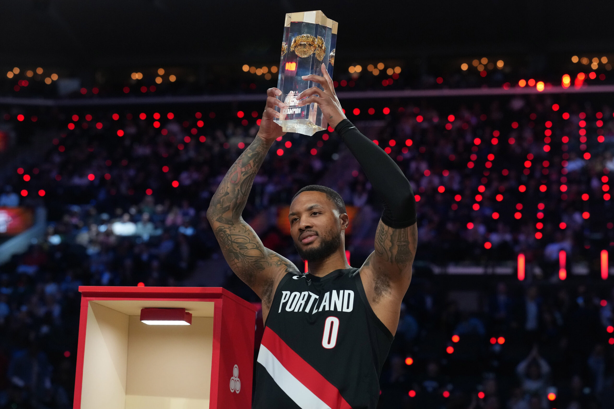 Feb 14, 2026; Los Angeles, CA, USA; Feb 14, 2026; Los Angeles, CA, USA; Portland Trail Blazers guard Damian Lillard (0) holds the trophy after winning the three point contest during the 2026 NBA All Star Saturday Night at Intuit Dome. Mandatory Credit: Kirby Lee-Imagn Images