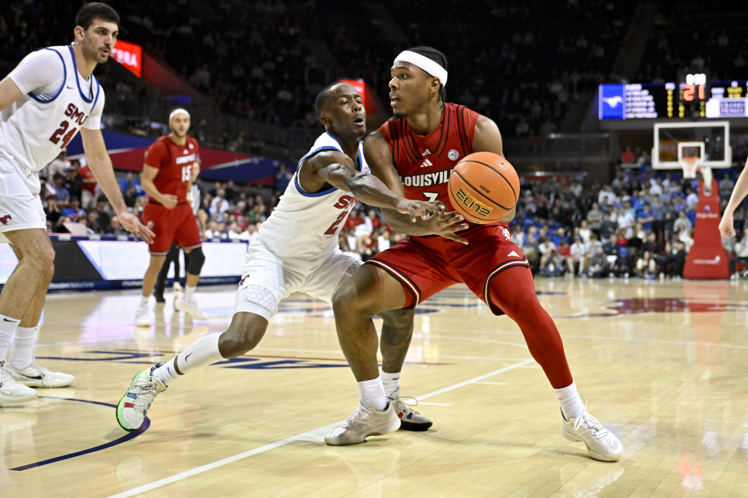 Feb 17, 2026; Dallas, Texas, USA; SMU Mustangs guard Boopie Miller (2) attempts to knock the ball away from Louisville Cardinals guard Ryan Conwell (3) during the first half at Moody Coliseum. Mandatory Credit: Jerome Miron-Imagn Images