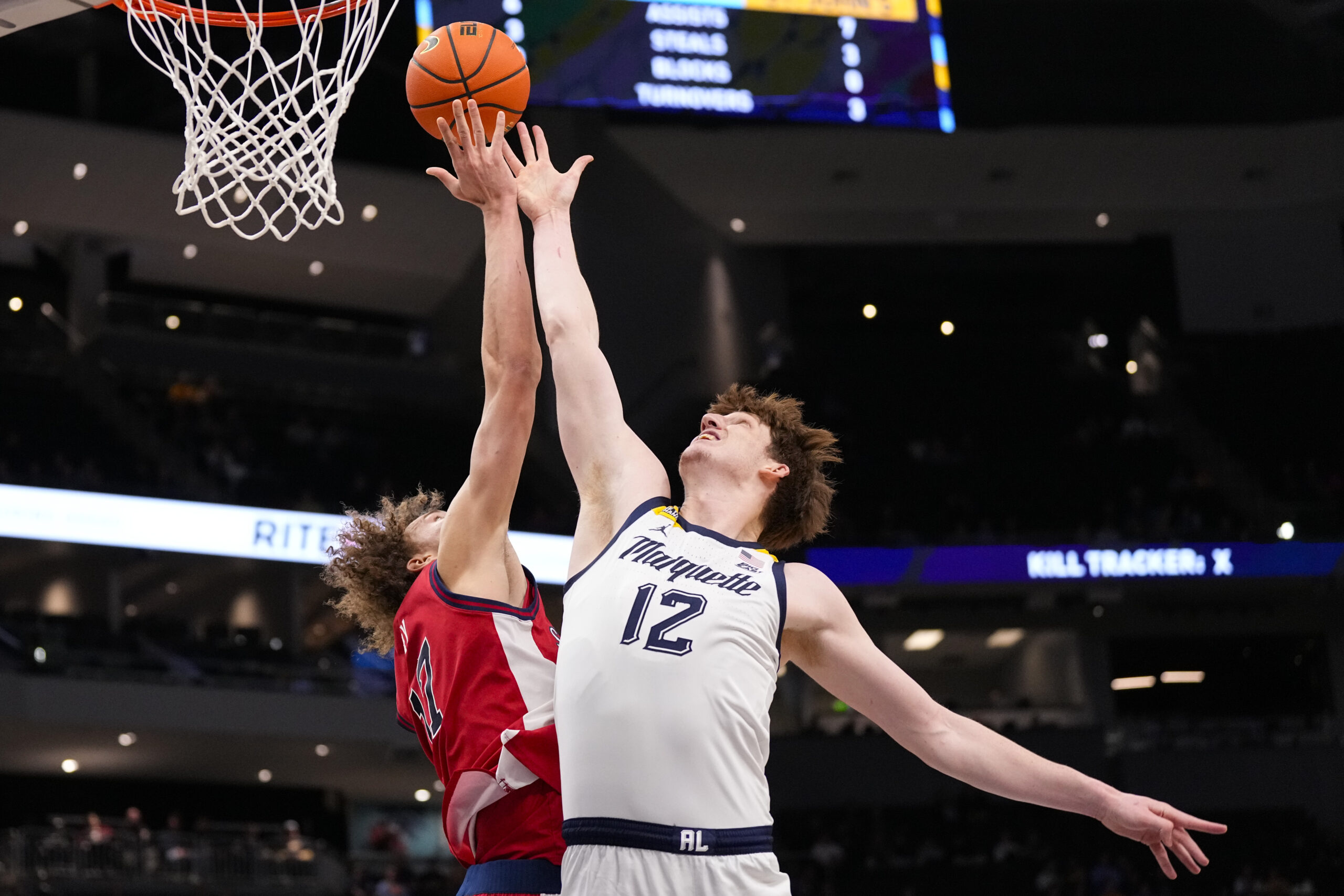 Feb 18, 2026; Milwaukee, Wisconsin, USA; Marquette Golden Eagles forward Ben Gold (12) and St. John’s Red Storm forward Ruben Prey (17) reach for a rebound during the first half at Fiserv Forum. Mandatory Credit: Jeff Hanisch-Imagn Images