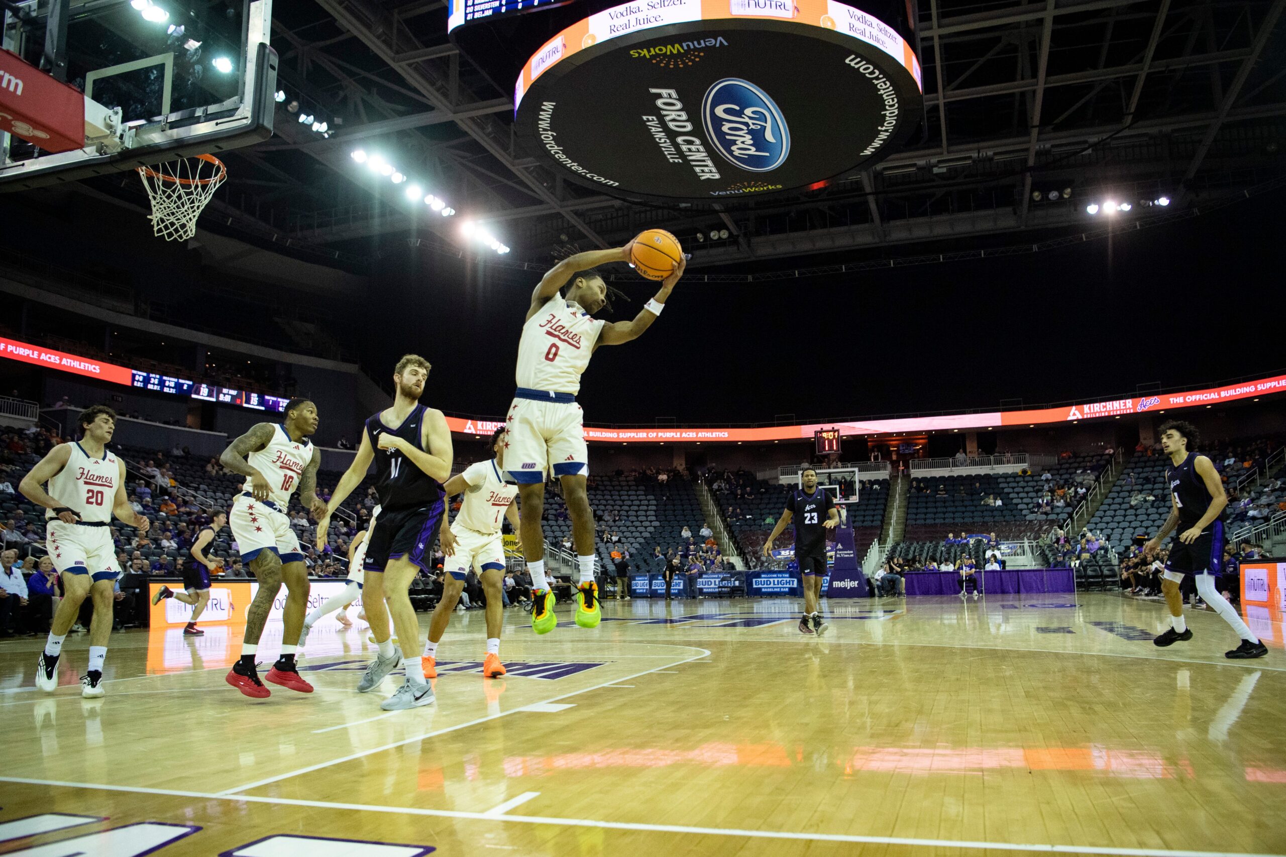 Illinois Chicago's Ahmad Henderson II (0) grabs a rebound as the University of Evansville Purple Aces play the University of Illinois Chicago Flames at Ford Center in Evansville, Ind., Wednesday, Feb. 18, 2026.