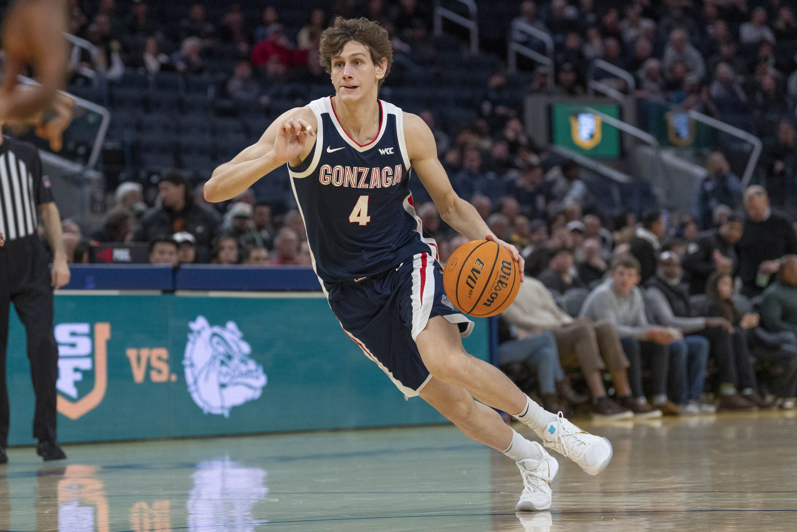Feb 18, 2026; San Francisco, California, USA;  Gonzaga Bulldogs guard Davis Fogle (4) drives the ball during the second half against the San Francisco Dons at Chase Center. Mandatory Credit: Stan Szeto-Imagn Images
