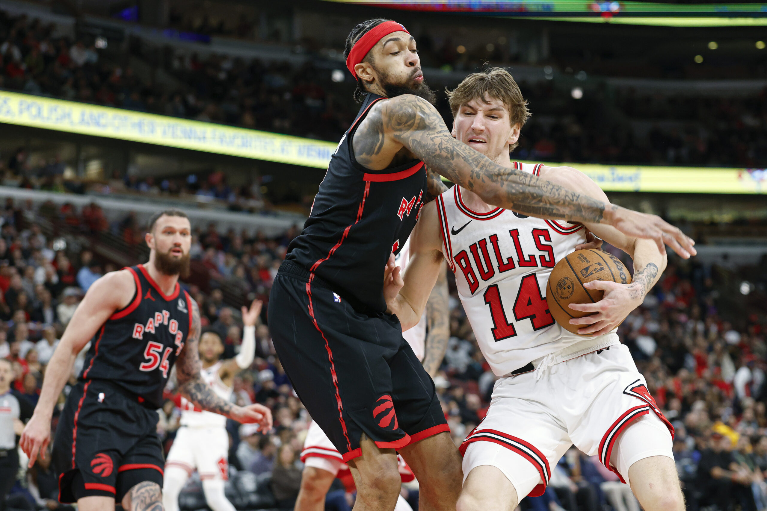 Feb 19, 2026; Chicago, Illinois, USA; Toronto Raptors forward Brandon Ingram (3) defends against Chicago Bulls forward Matas Buzelis (14) during the second half at United Center. Mandatory Credit: Kamil Krzaczynski-Imagn Images