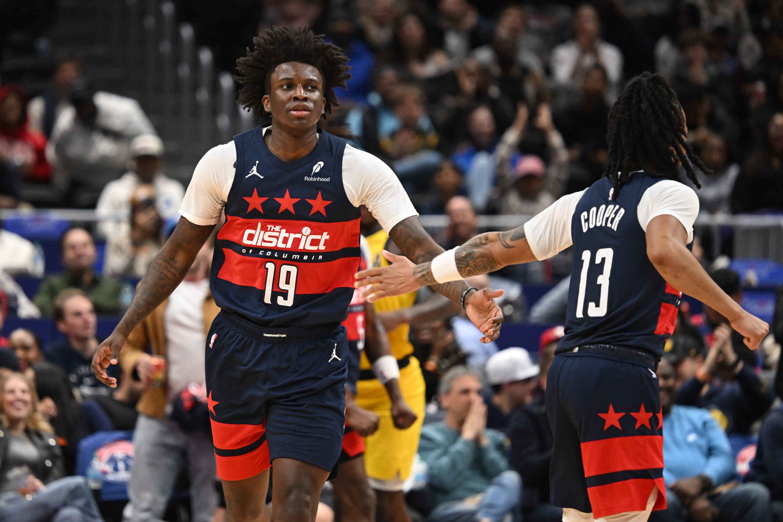 Feb 20, 2026; Washington, District of Columbia, USA; Washington Wizards guard Kadary Richmond (19) celebrates a play with teammate guard Sharife Cooper (13) against the Indiana Pacers during the fourth quarter at Capital One Arena. Mandatory Credit: Rafael Suanes-Imagn Images
