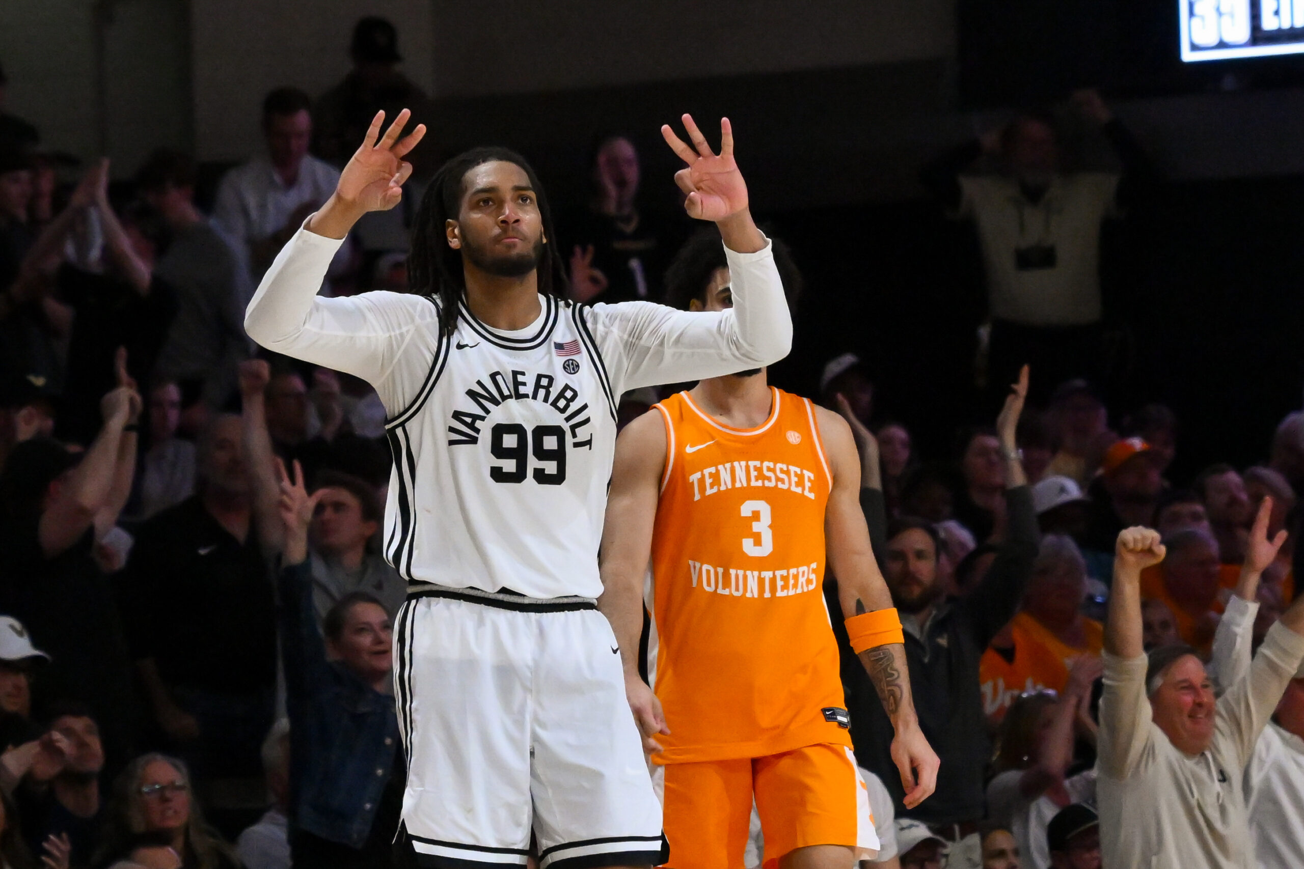 Feb 21, 2026; Nashville, Tennessee, USA;  Vanderbilt Commodores forward Devin McGlockton (99) reacts after a made three point basket made by forward Tyler Nickel (5) against the Tennessee Volunteers during the second half at Memorial Gymnasium. Mandatory Credit: Steve Roberts-Imagn Images