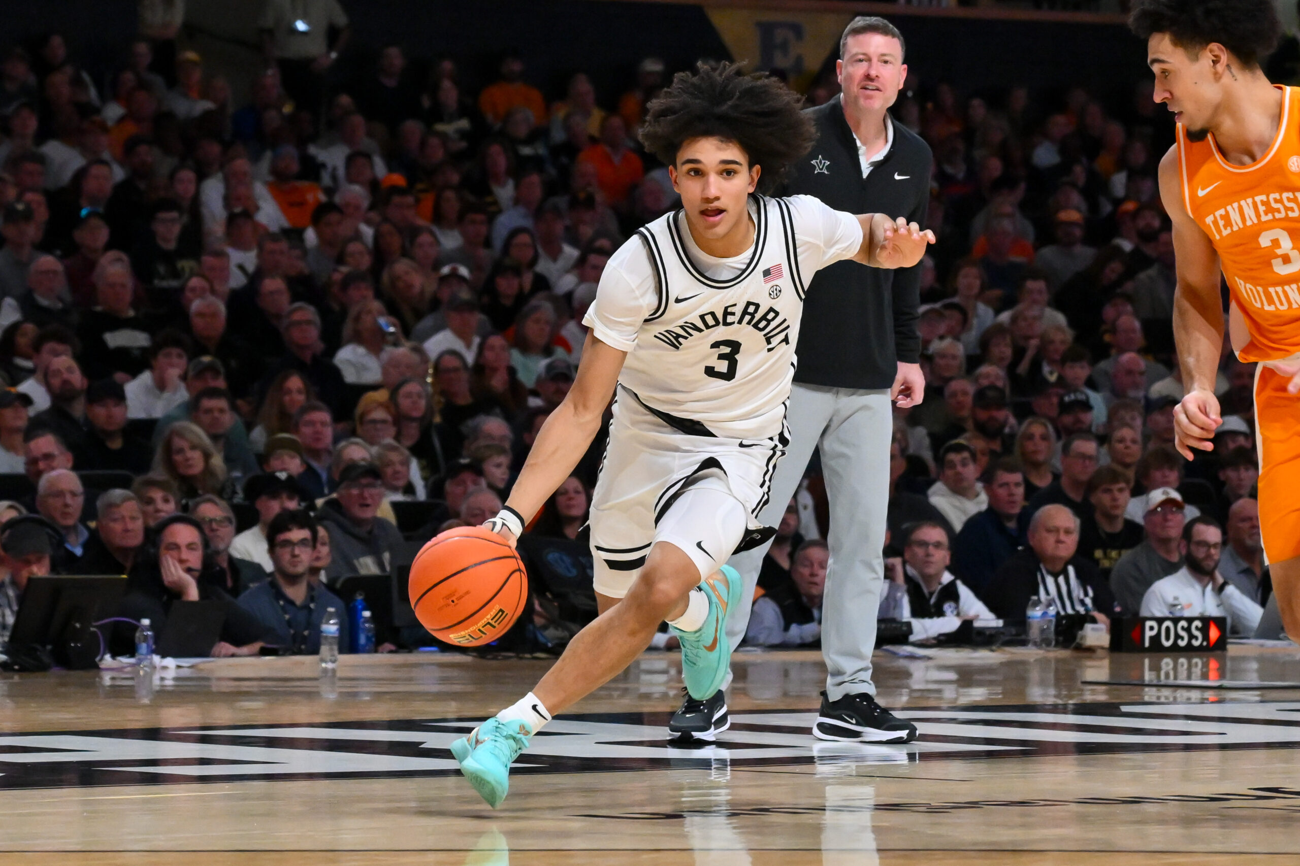 Feb 25, 2026; Nashville, Tennessee, USA; Vanderbilt Commodores guard Tyler Tanner (3) drives to the basket past Tennessee Volunteers guard Bishop Boswell (3) during the second half at Memorial Gymnasium. Mandatory Credit: Steve Roberts-Imagn Images