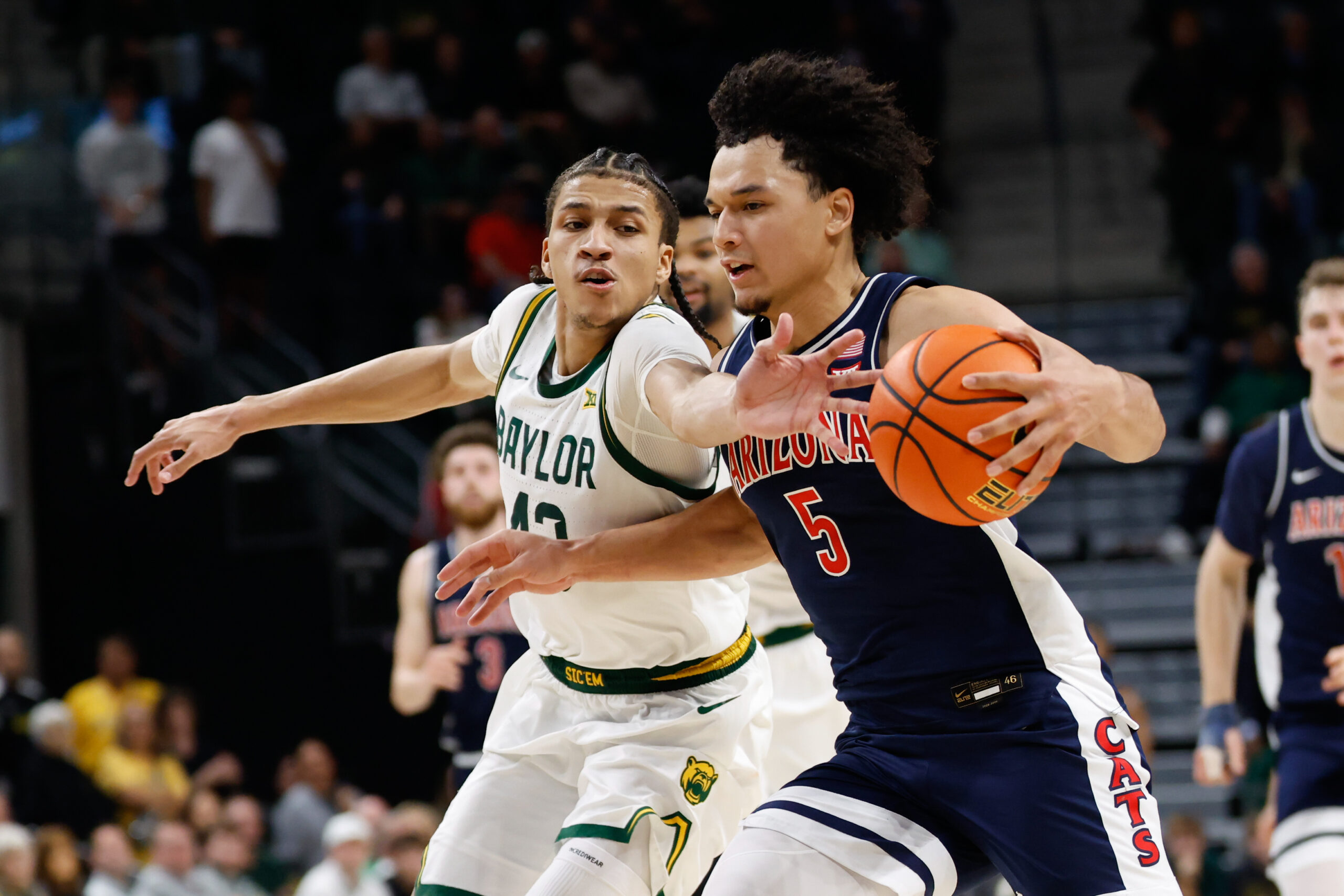 Feb 24, 2026; Waco, Texas, USA;  Arizona Wildcats guard Brayden Burries (5) is fouled by Baylor Bears guard Cameron Carr (43) during the second half at Paul and Alejandra Foster Pavilion. Mandatory Credit: Chris Jones-Imagn Images