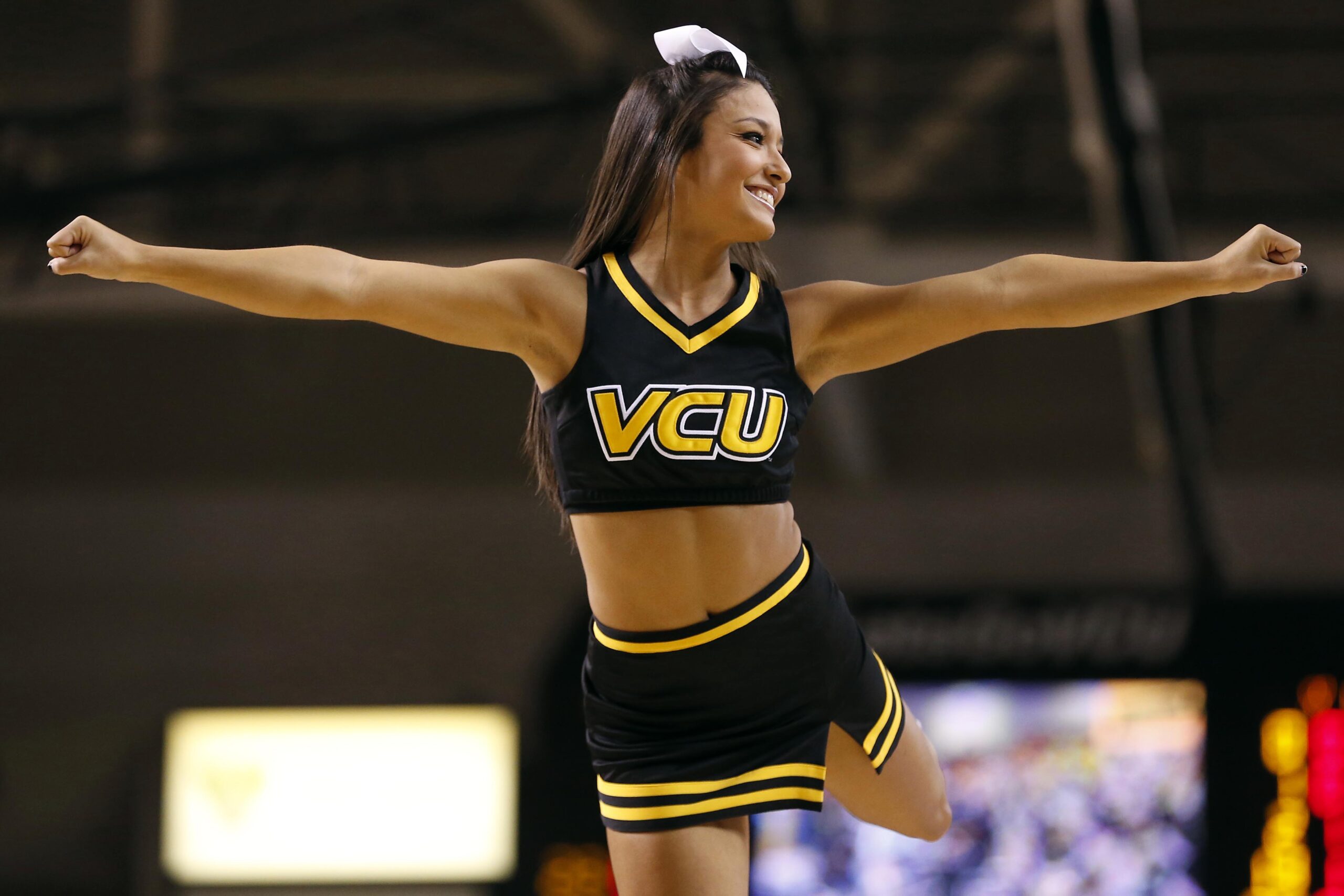 Jan 29, 2014; Richmond, VA, USA; A Virginia Commonwealth Rams cheerleader cheers during a stoppage in play against the Fordham Rams in the first half at Stuart C. Siegel Center. The Rams won 76-60. Mandatory Credit: Geoff Burke-Imagn Images