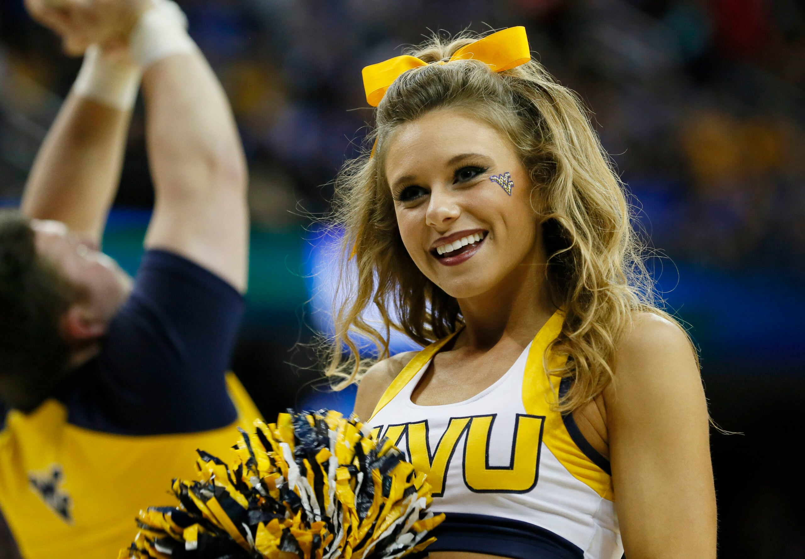 Mar 26, 2015; Cleveland, OH, USA; West Virginia Mountaineers cheerleader during the first half against the Kentucky Wildcats in the semifinals of the midwest regional of the 2015 NCAA Tournament at Quicken Loans Arena. Mandatory Credit: Rick Osentoski-Imagn Images