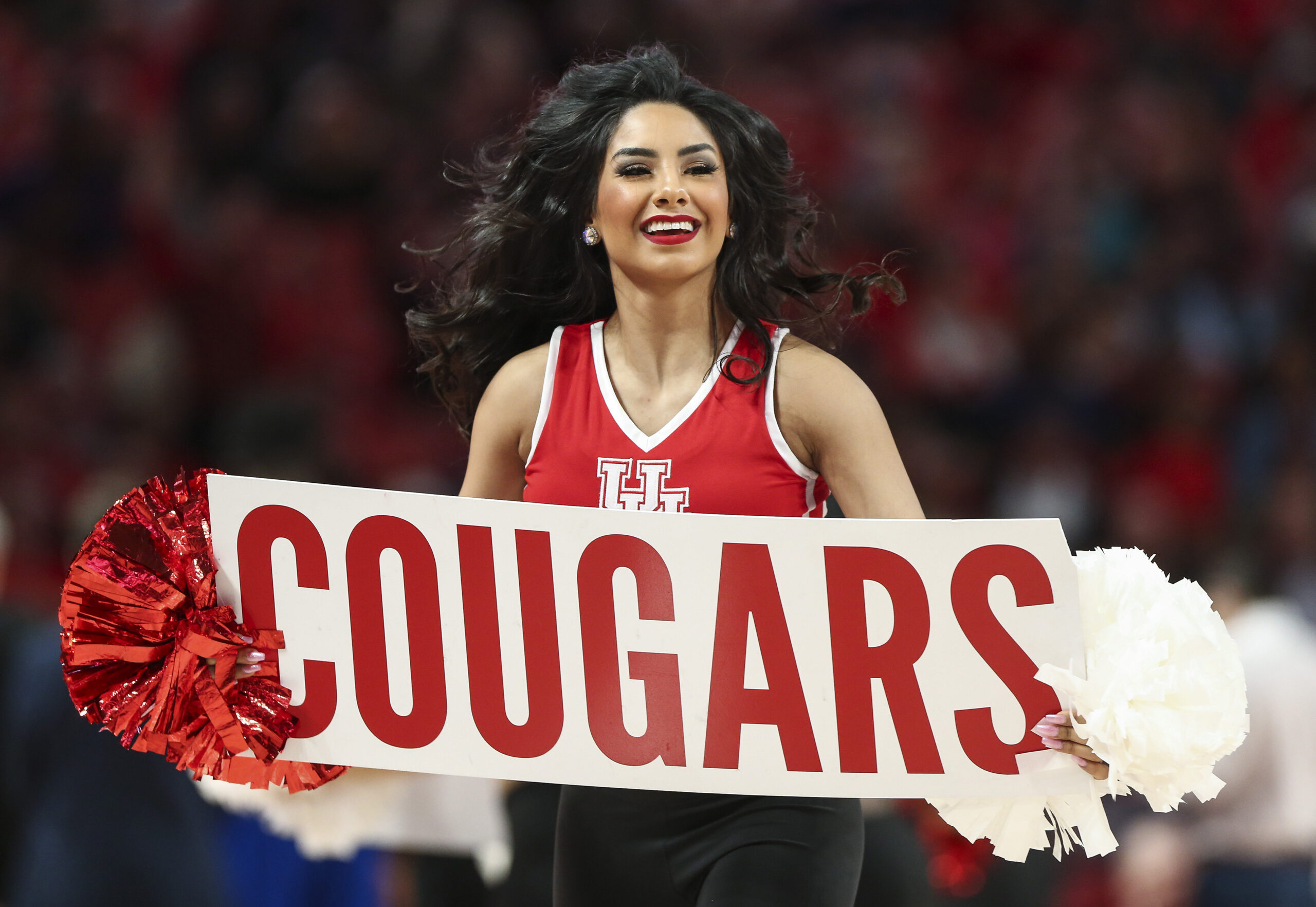 Feb 19, 2020; Houston, Texas, USA; Houston Cougars cheerleaders perform during the first half against the Tulsa Golden Hurricane at Fertitta Center. Mandatory Credit: Troy Taormina-Imagn Images