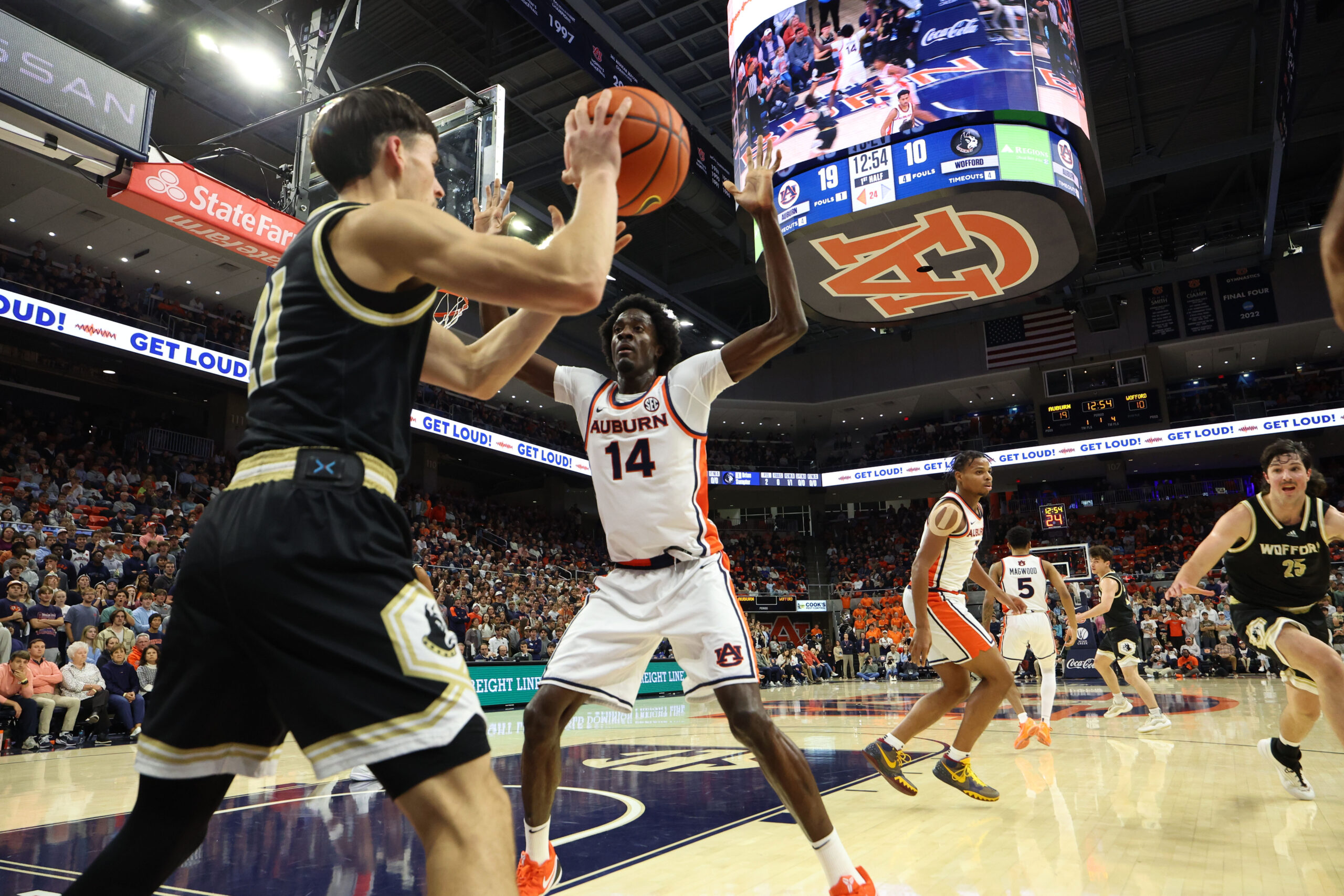 Nov 11, 2025; Auburn, Alabama, USA; Auburn Tigers center Emeka Opurum (14) pressures Wofford Terriers guard Nils MacHowski (21) on an inbounds pass during the first half at Neville Arena. Mandatory Credit: John Reed-Imagn Images