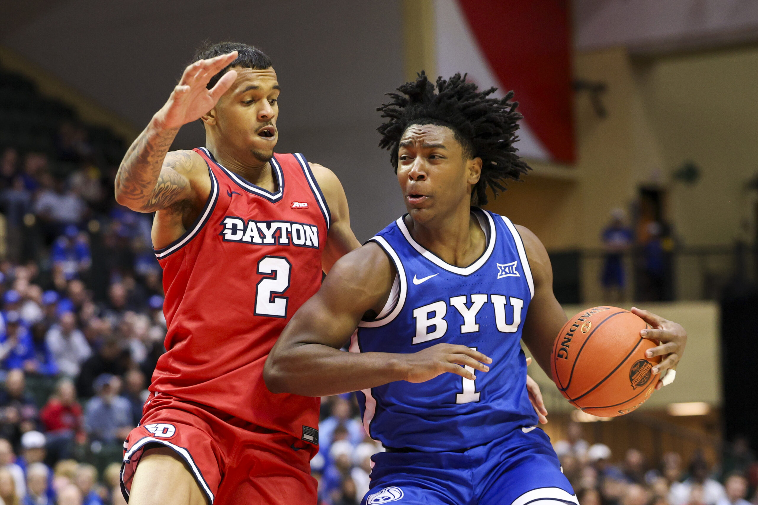 Nov 28, 2025; Kissimmee, FL, USA; Brigham Young University Cougars guard Robert Wright III (1) is guarded by Dayton Flyers guard De'Shayne Montgomery (2) in the second half during the ESPN Events Invitational at State Farm Field House. Mandatory Credit: Nathan Ray Seebeck-Imagn Images