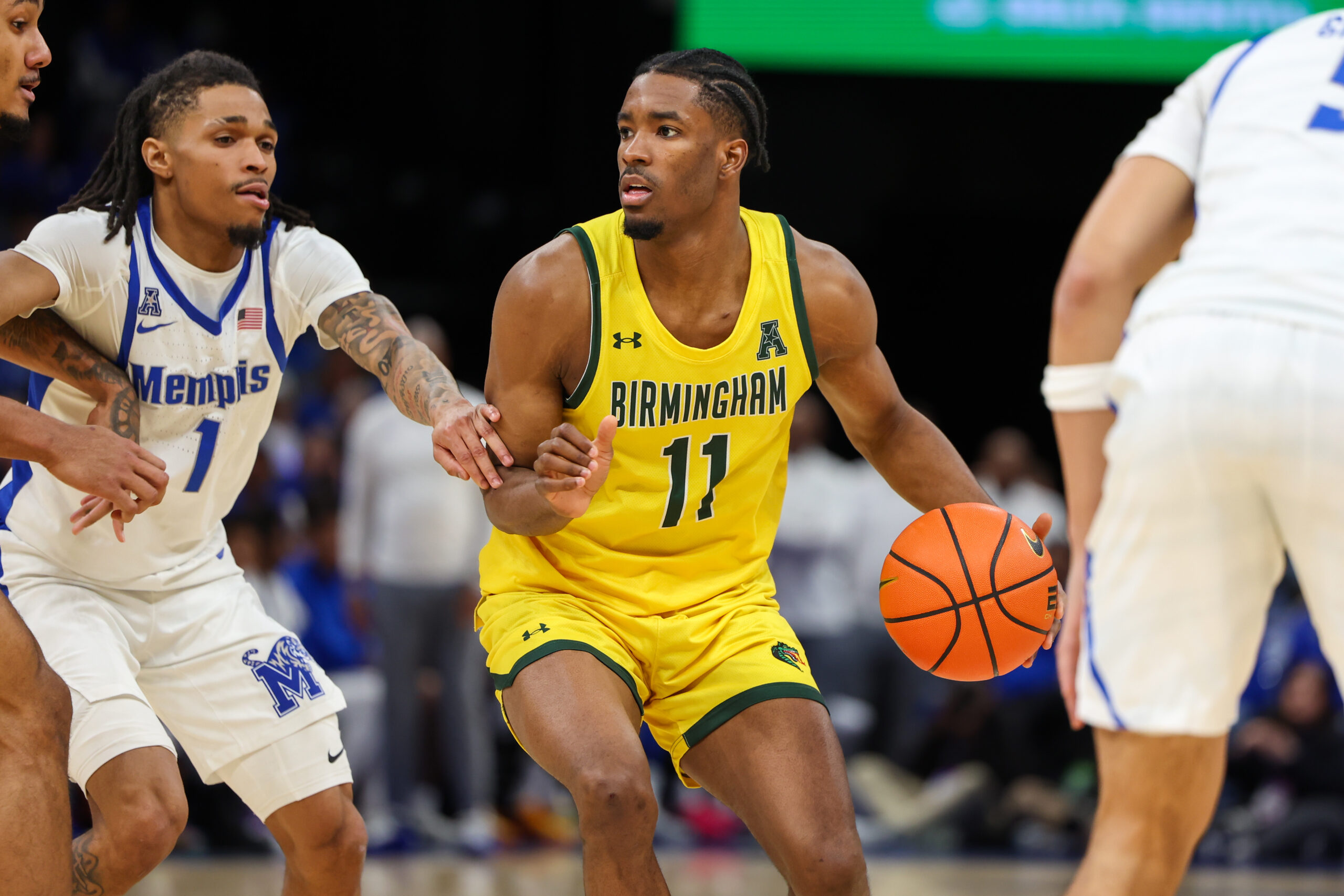 Feb 22, 2026; Memphis, Tennessee, USA; UAB Blazers guard Chance Westry (11) handles the ball against Memphis Tigers guard Dug McDaniel (1) during the second half at FedExForum. Mandatory Credit: Wesley Hale-Imagn Images