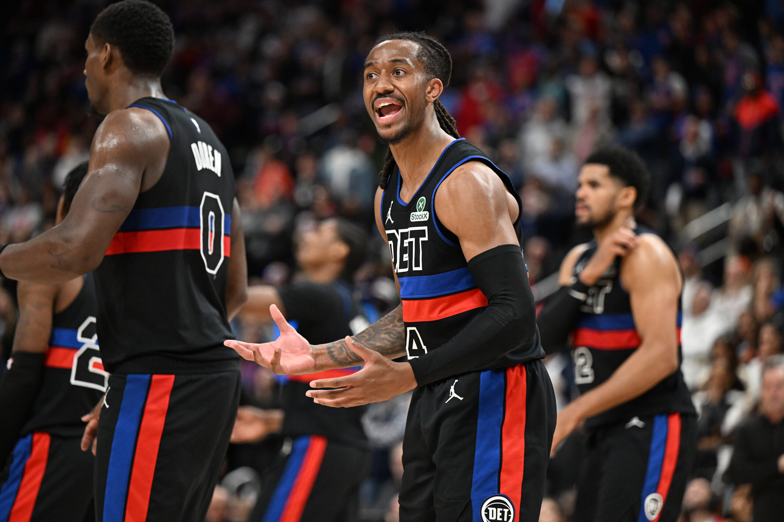 Feb 27, 2026; Detroit, Michigan, USA; Detroit Pistons guard Daniss Jenkins (24) argues a foul call against the Cleveland Cavaliers with an official in overtime at Little Caesars Arena. Mandatory Credit: Lon Horwedel-Imagn Images