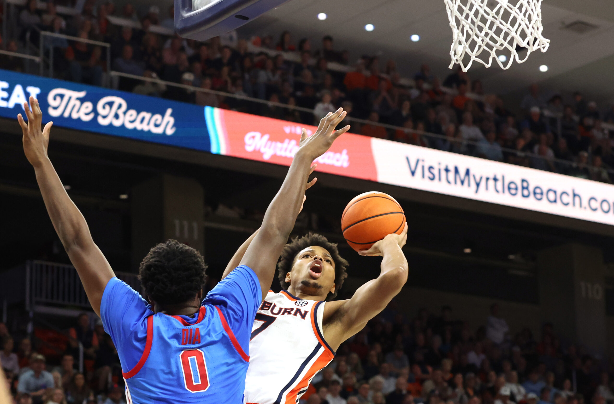 Feb 28, 2026; Auburn, Alabama, USA;  Auburn Tigers guard Keyshawn Hall (7) takes a shot against Mississippi Rebels forward Malik Dia (0) during the second half at Neville Arena. Mandatory Credit: John Reed-Imagn Images