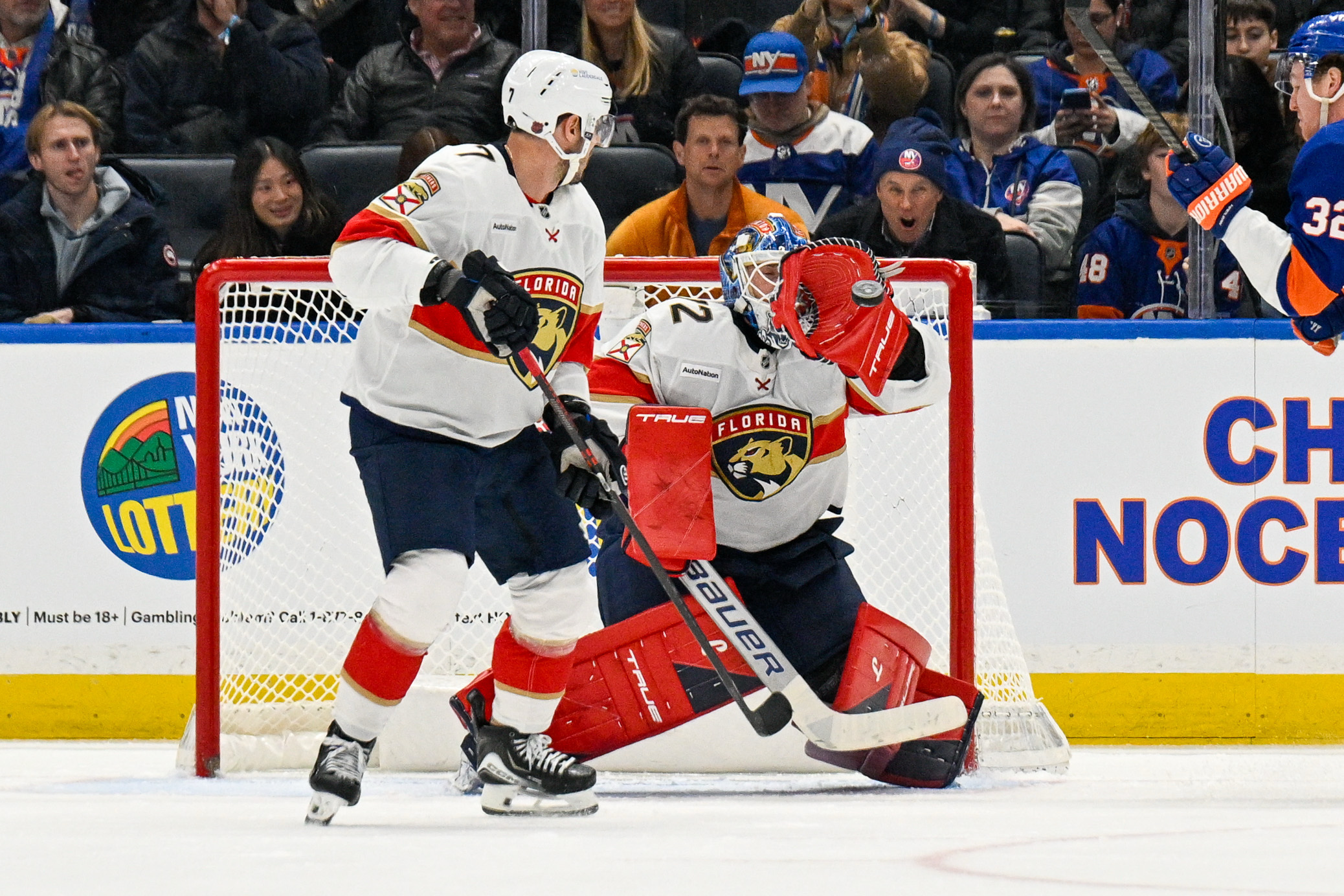 Mar 1, 2026; Elmont, New York, USA;  Florida Panthers goaltender Sergei Bobrovsky (72) makes a glove save against the New York Islanders during the third period at UBS Arena. Mandatory Credit: Dennis Schneidler-Imagn Images