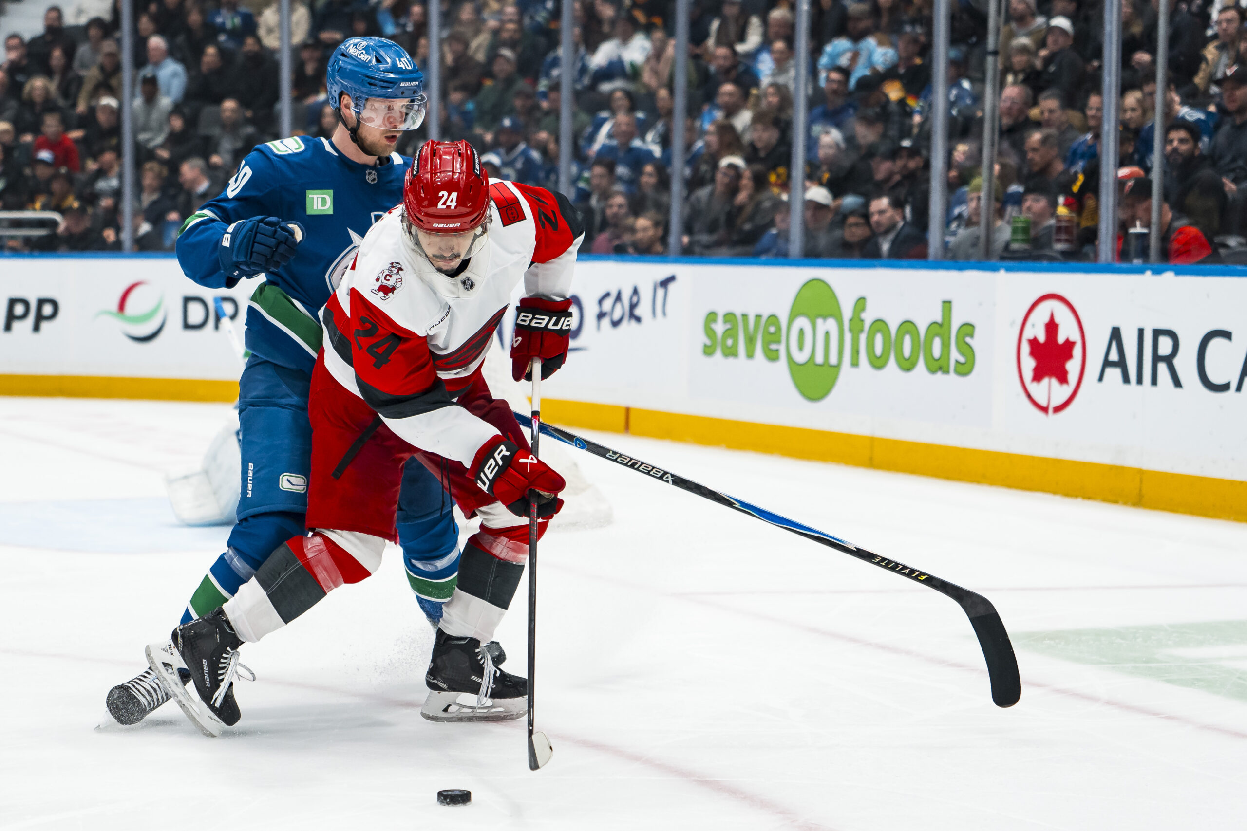 Mar 4, 2026; Vancouver, British Columbia, CAN; Vancouver Canucks forward Elias Pettersson (40) battles with Carolina Hurricanes forward Seth Jarvis (24) in the second at Rogers Arena. Mandatory Credit: Bob Frid-Imagn Images