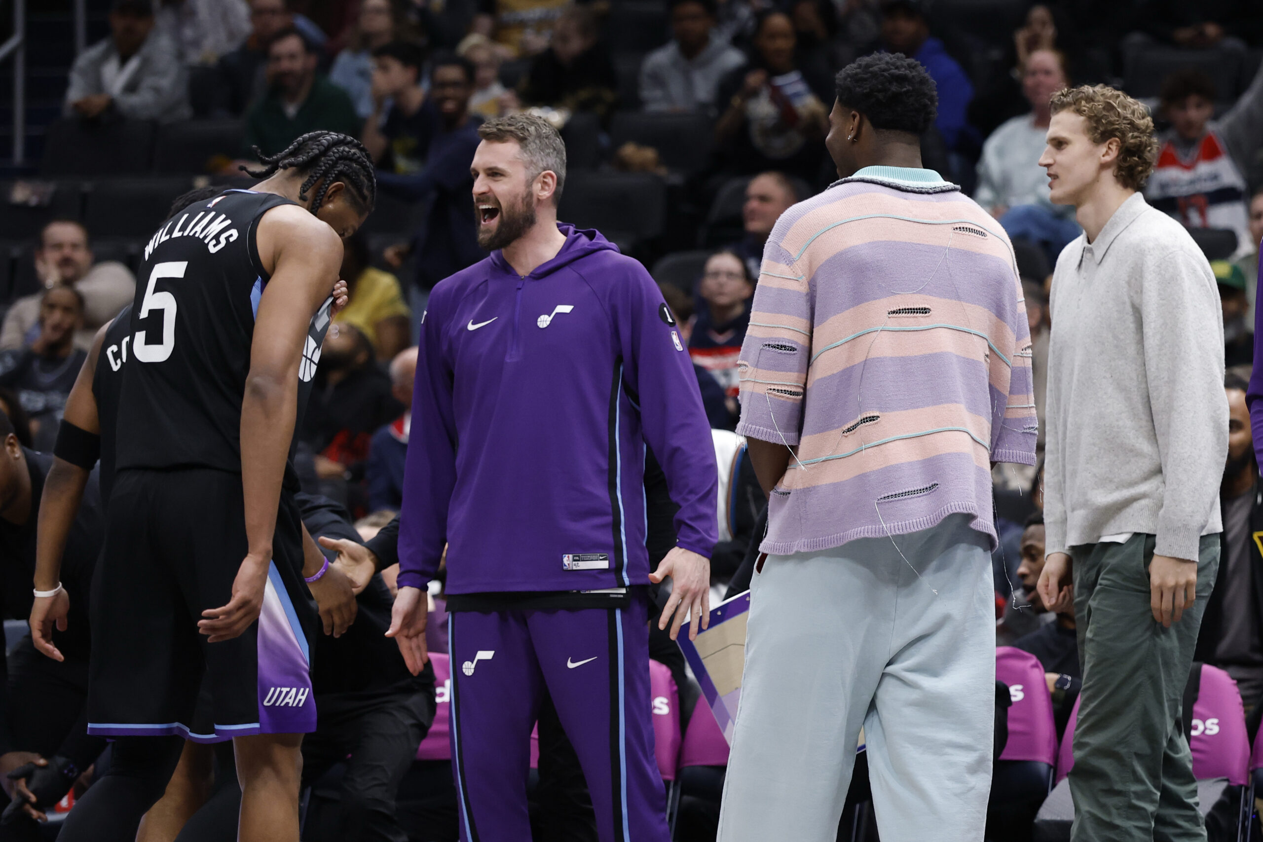 Mar 5, 2026; Washington, District of Columbia, USA; Utah Jazz guard Isaiah Collier (8) and Jazz forward Cody Williams (5) celebrate with teammates on the bench against the Washington Wizards in the second half at Capital One Arena. Mandatory Credit: Geoff Burke-Imagn Images
