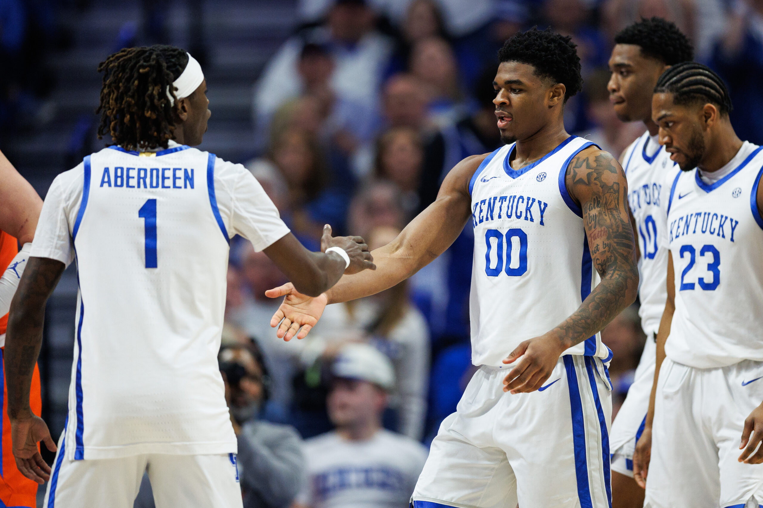 Mar 7, 2026; Lexington, Kentucky, USA; Kentucky Wildcats guard Otega Oweh (00) fives guard Denzel Aberdeen (1) during the first half against the Florida Gators at Rupp Arena at Central Bank Center. Mandatory Credit: Jordan Prather-Imagn Images