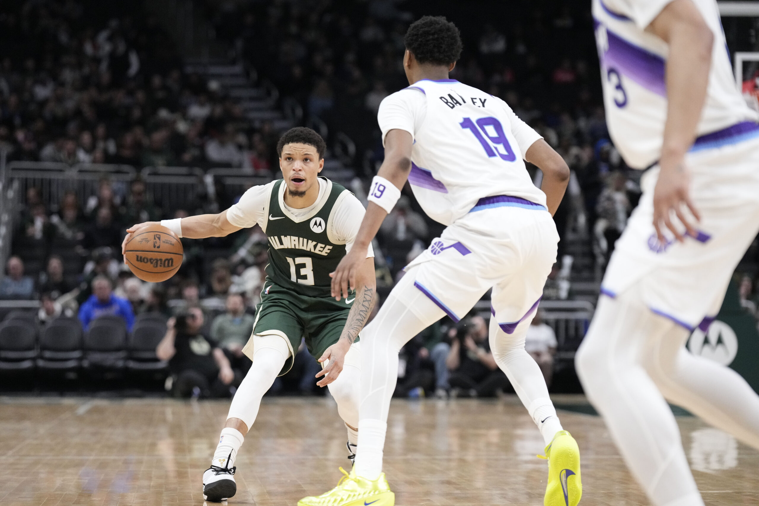 Mar 7, 2026; Milwaukee, Wisconsin, USA; Milwaukee Bucks guard Ryan Rollins (13) brings the ball up court against Utah Jazz forward Ace Bailey (19) in the second half at Fiserv Forum. Mandatory Credit: Michael McLoone-Imagn Images