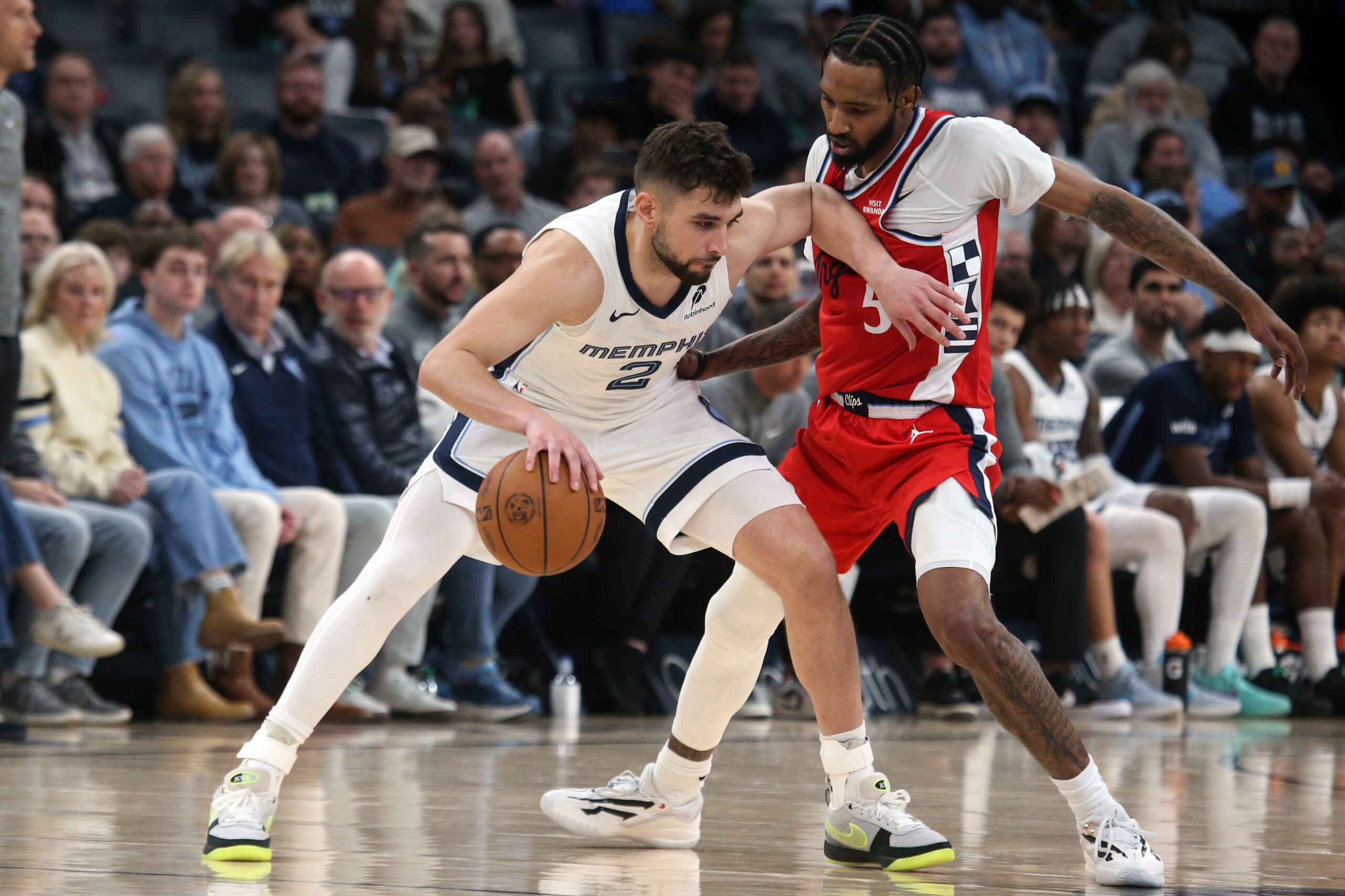 Mar 7, 2026; Memphis, Tennessee, USA; Memphis Grizzlies guard Ty Jerome (2) dribbles as Los Angeles Clippers forward Derrick Jones Jr. (5) defends during the fourth quarter at FedExForum. Mandatory Credit: Petre Thomas-Imagn Images
