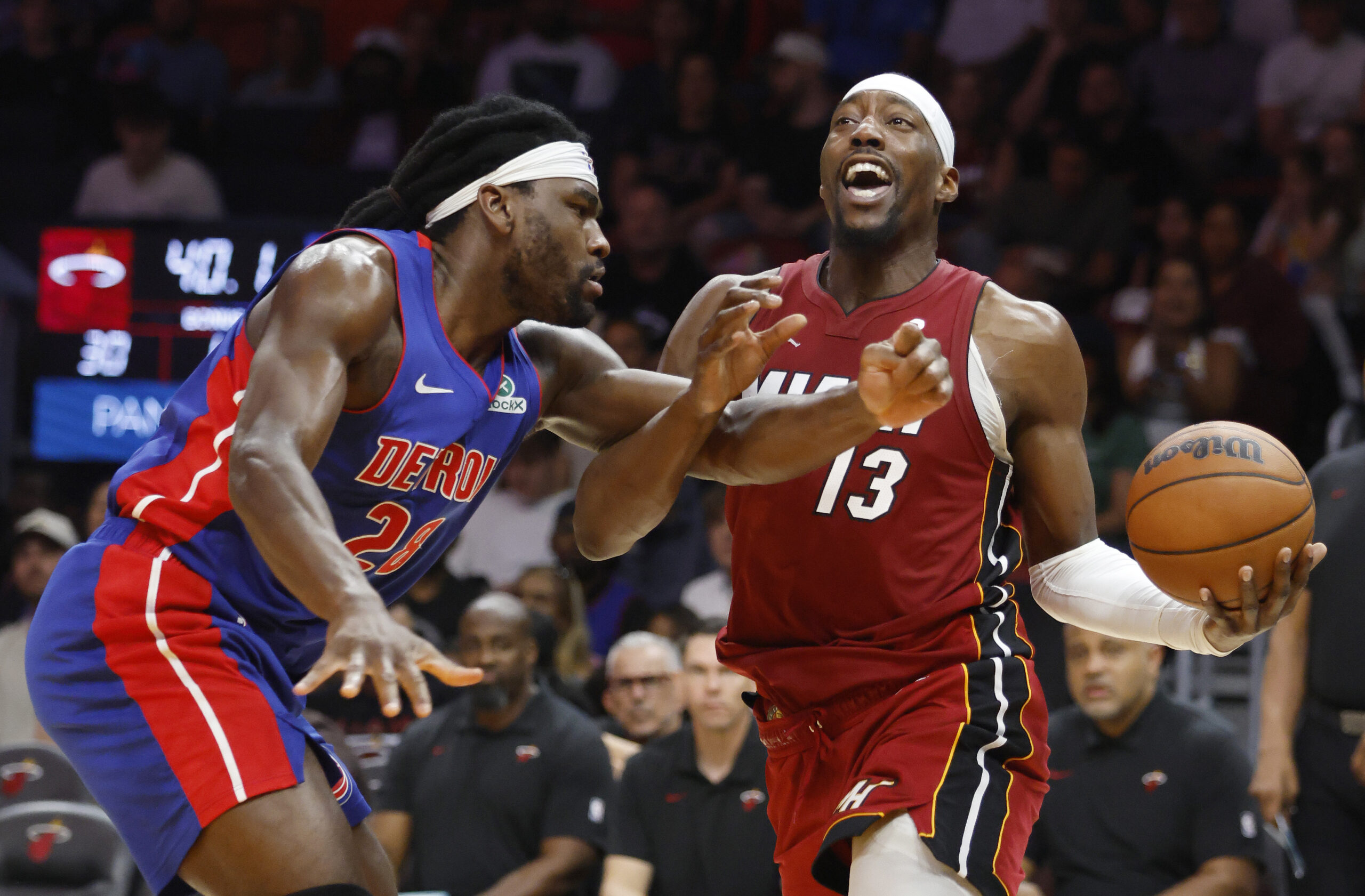 Mar 8, 2026; Miami, Florida, USA;  Detroit Pistons forward Isaiah Stewart (28) fouls Miami Heat center Bam Adebayo (13) during the first half at Kaseya Center. Mandatory Credit: Rhona Wise-Imagn Images