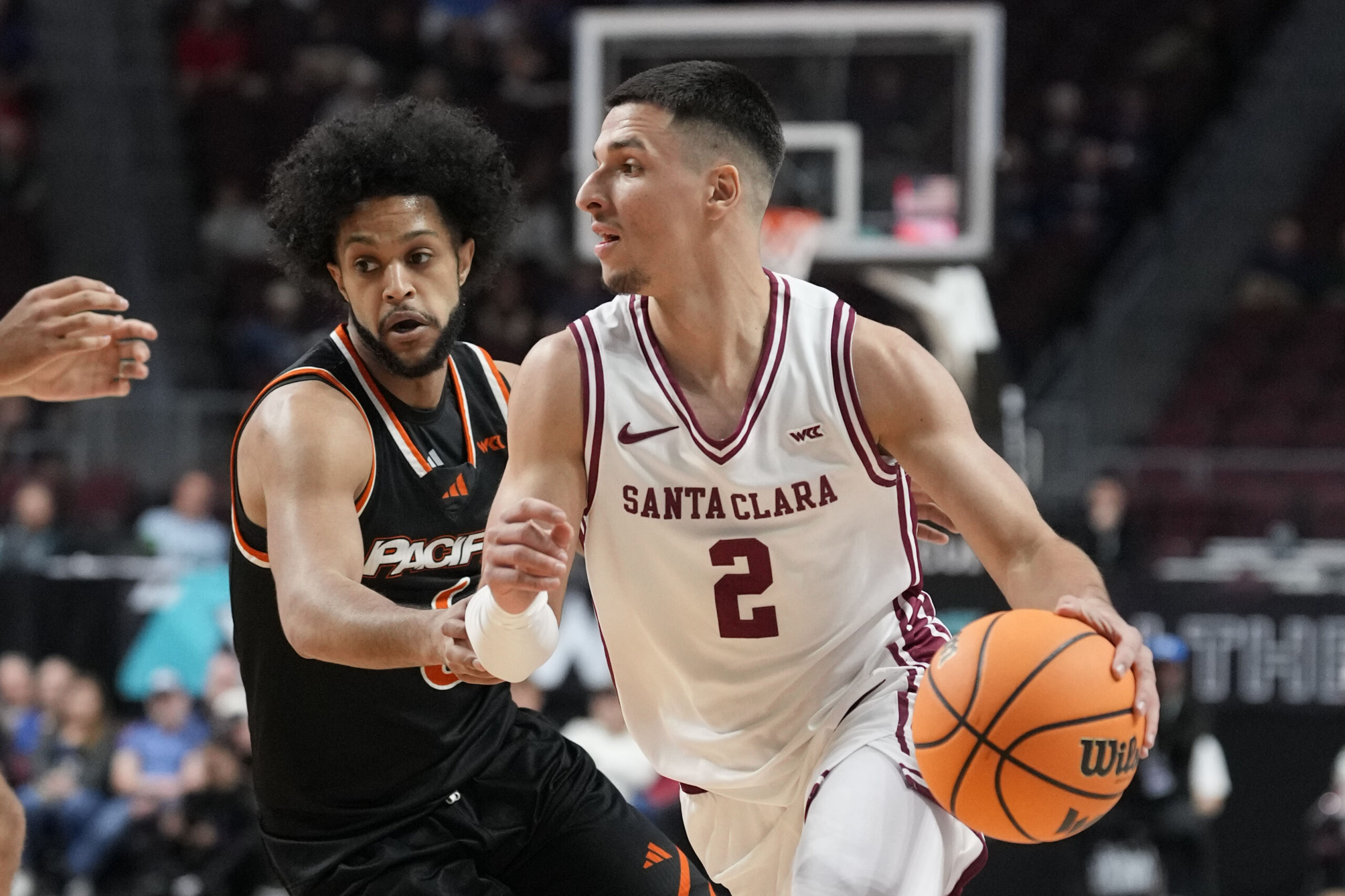 March 8, 2026; Las Vegas, NV, USA; Santa Clara Broncos guard Sash Gavalyugov (2) dribbles the basketball against Pacific Tigers guard Jaden Clayton (6) during the first half at Orleans Arena. Mandatory Credit: Kyle Terada-Imagn Images