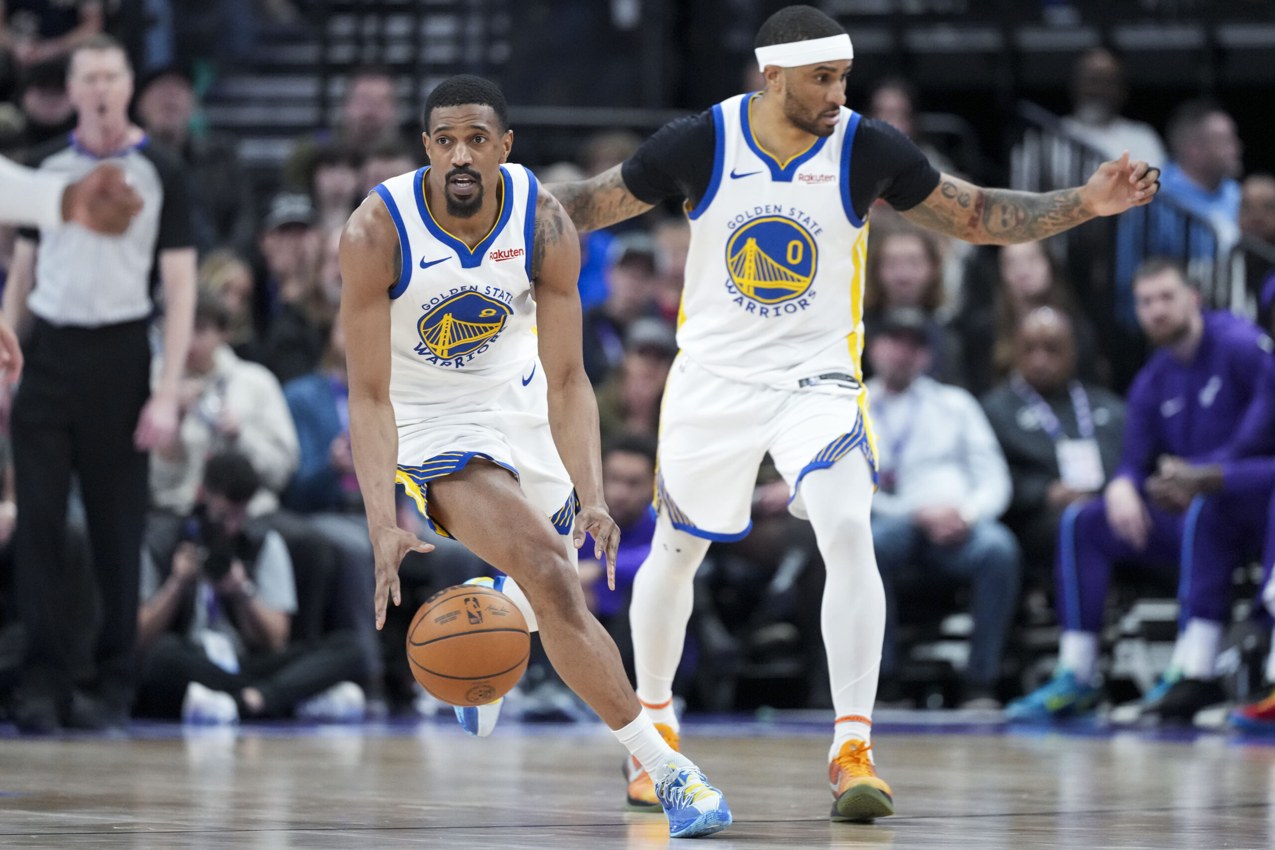 Mar 9, 2026; Salt Lake City, Utah, USA; Golden State Warriors guard De'Anthony Melton (8) dribbles down the court ahead of guard Gary Payton II (0) in the fourth quarter at Delta Center.  Mandatory Credit: Gabriel Mayberry-Imagn Images