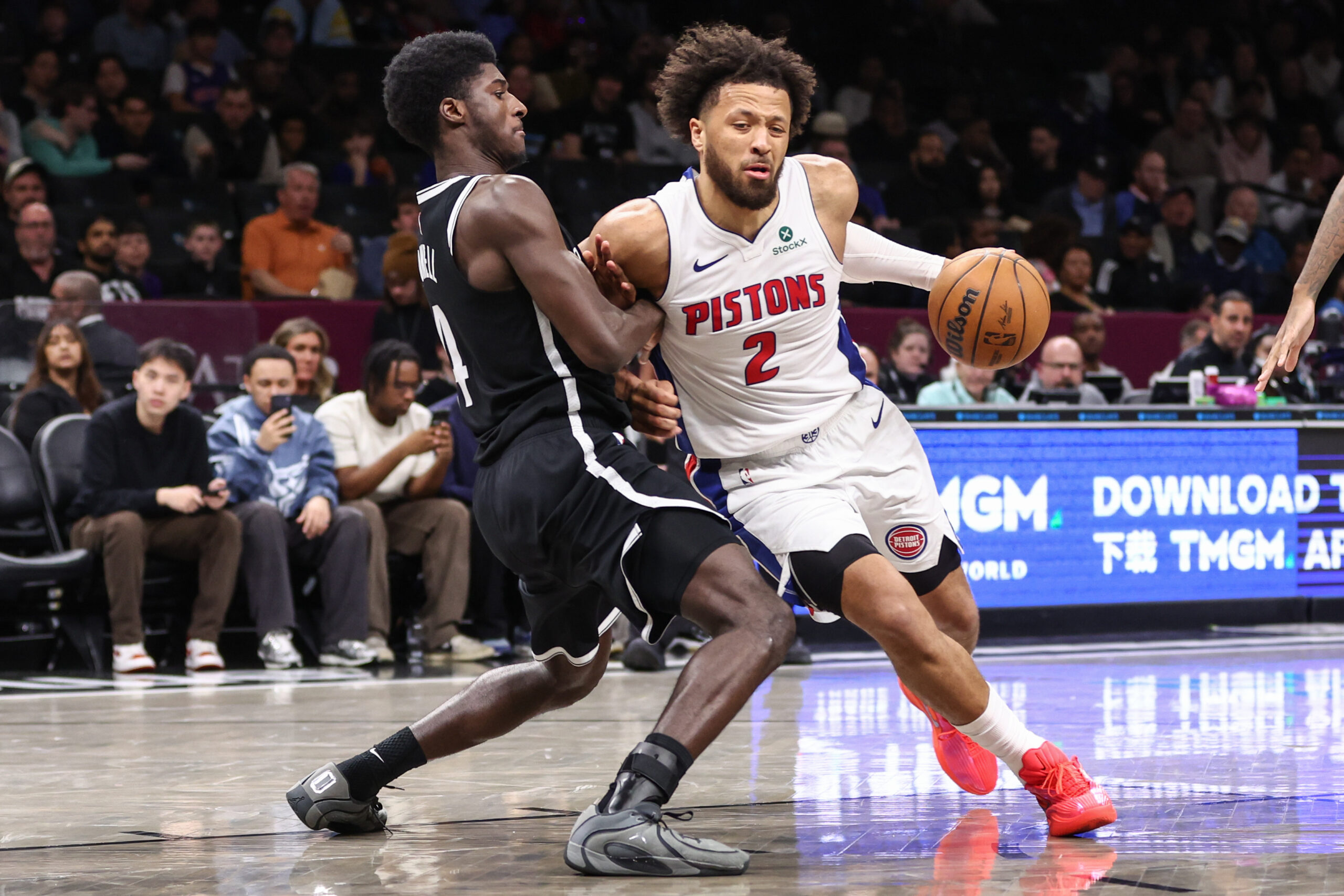 Mar 10, 2026; Brooklyn, New York, USA;  Detroit Pistons guard Cade Cunningham (2) looks to drive past Brooklyn Nets guard Drake Powell (4) in the third quarter at Barclays Center. Mandatory Credit: Wendell Cruz-Imagn Images