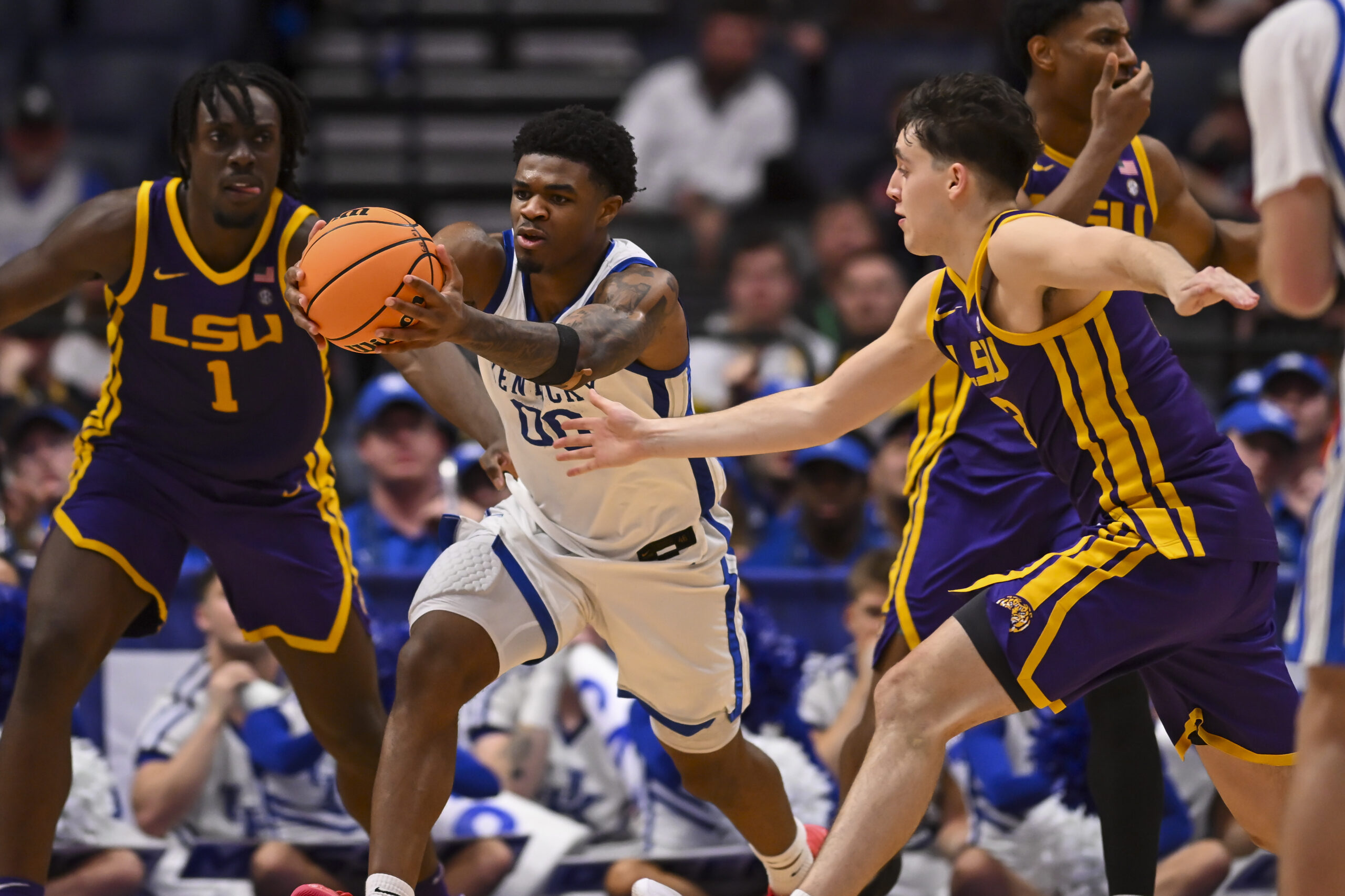 Mar 11, 2026; Nashville, TN, USA; Louisiana State Tigers center Michael Nwoko (1) and guard Max MacKinnon (3) fight for a loose ball with Kentucky Wildcats guard Otega Oweh (00) during the second half at Bridgestone Arena. Mandatory Credit: Steve Roberts-Imagn Images