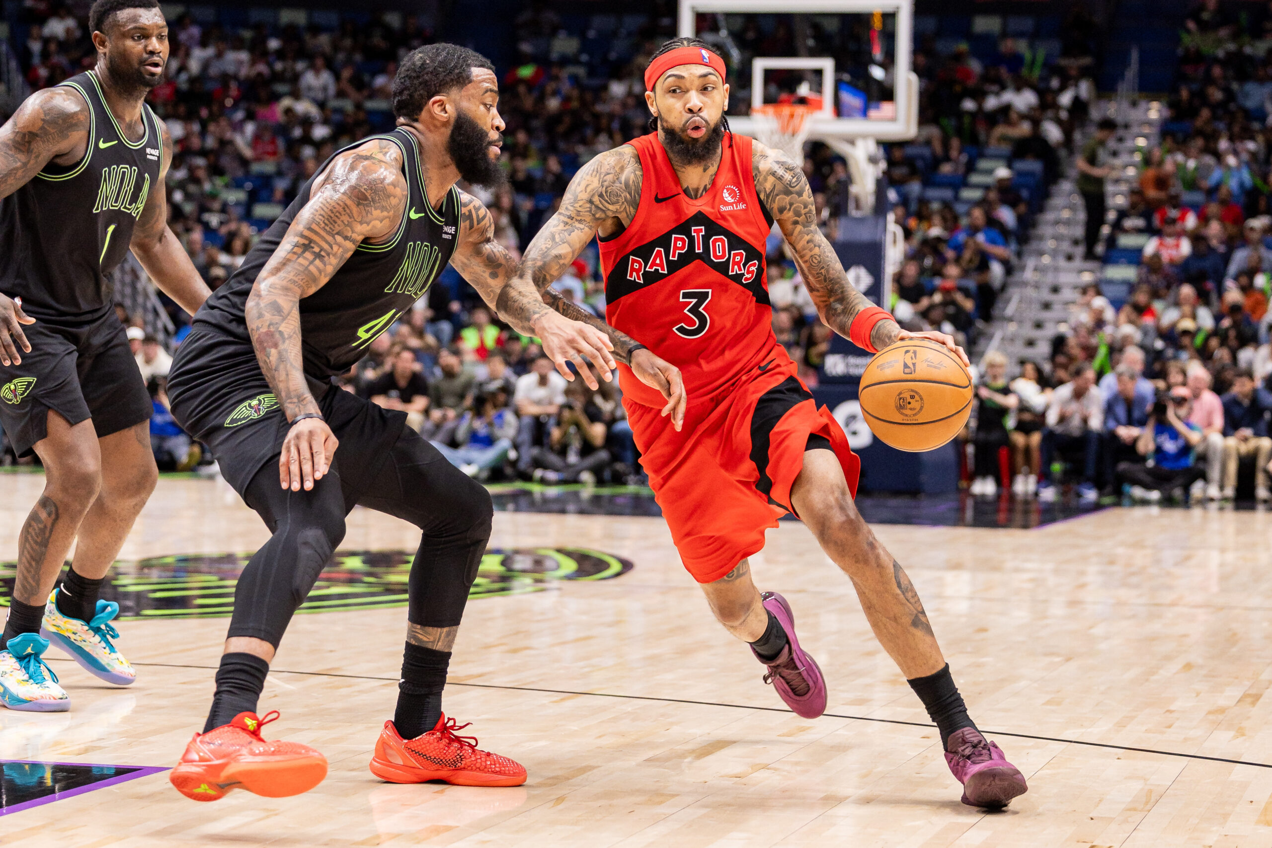Mar 11, 2026; New Orleans, Louisiana, USA;  Toronto Raptors forward Brandon Ingram (3) dribbles against New Orleans Pelicans guard/forward Saddiq Bey (41) during the second half at Smoothie King Center. Mandatory Credit: Stephen Lew-Imagn Images