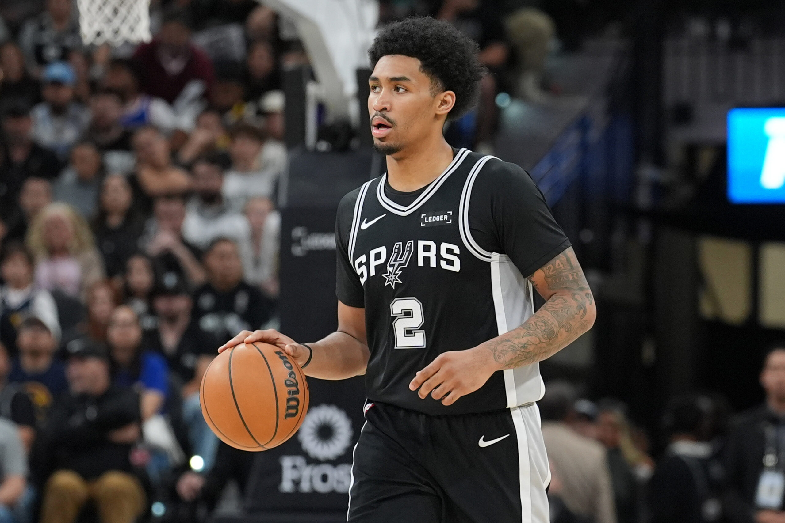 Mar 12, 2026; San Antonio, Texas, USA;  San Antonio Spurs guard Dylan Harper (2) dribbles the ball in the second half against the Denver Nuggets at Frost Bank Center. Mandatory Credit: Daniel Dunn-Imagn Images