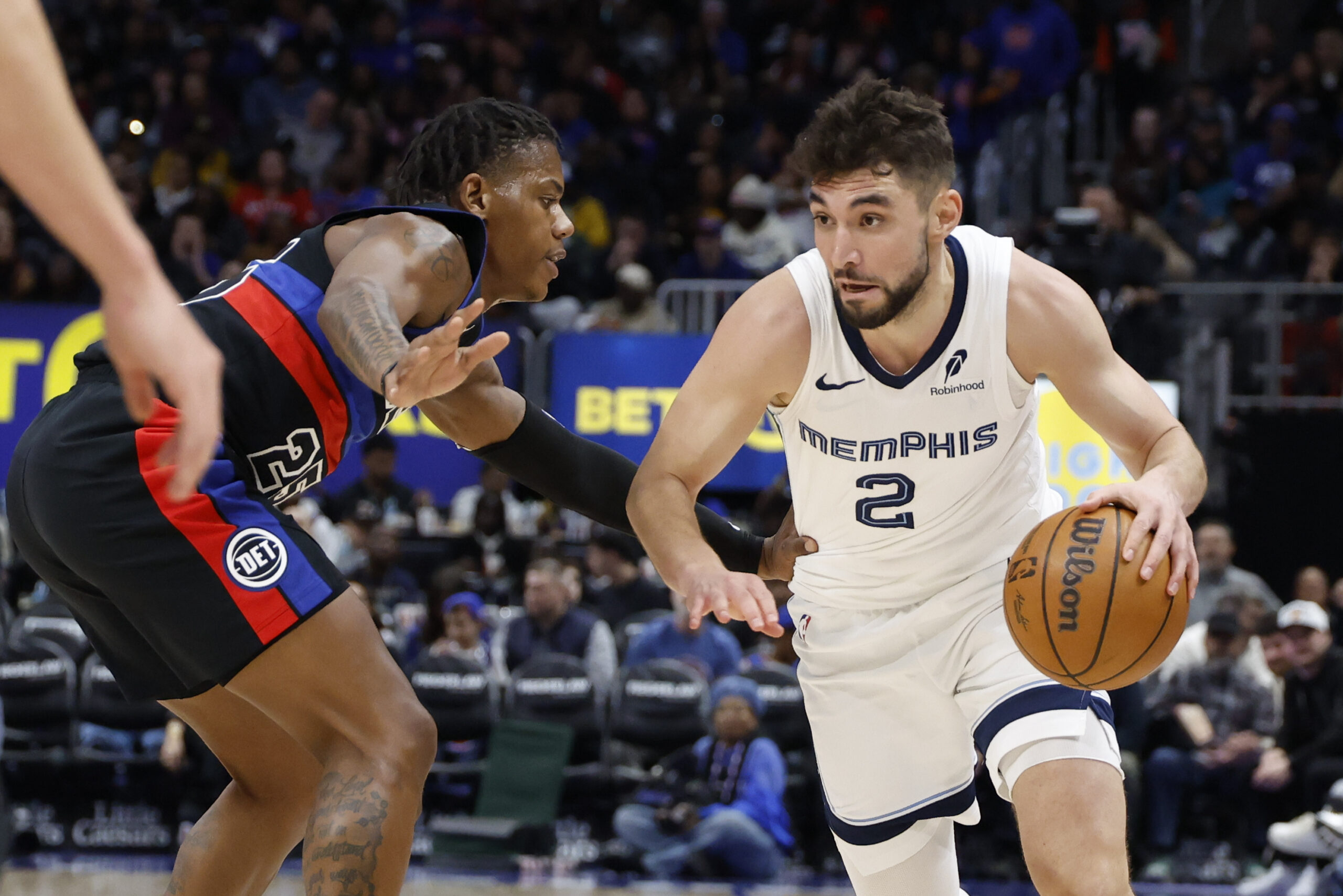 Mar 13, 2026; Detroit, Michigan, USA;  Memphis Grizzlies guard Ty Jerome (2) dribbles defended by Detroit Pistons guard Marcus Sasser (25) in the second half at Little Caesars Arena. Mandatory Credit: Rick Osentoski-Imagn Images