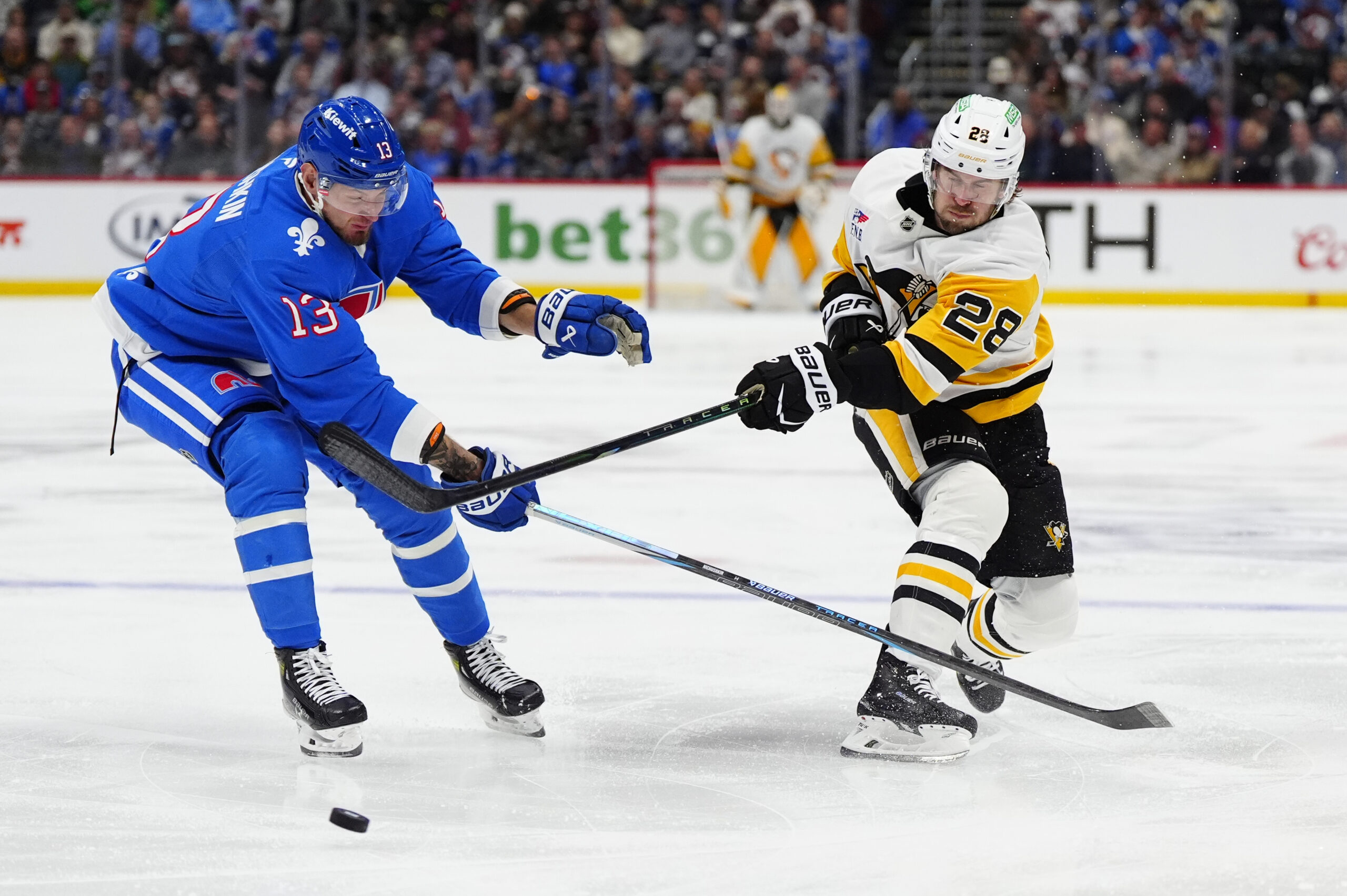 Mar 16, 2026; Denver, Colorado, USA; Colorado Avalanche right wing Valeri Nichushkin (13) defends on Pittsburgh Penguins defenseman Parker Wotherspoon (28) in the third period at Ball Arena. Mandatory Credit: Ron Chenoy-Imagn Images