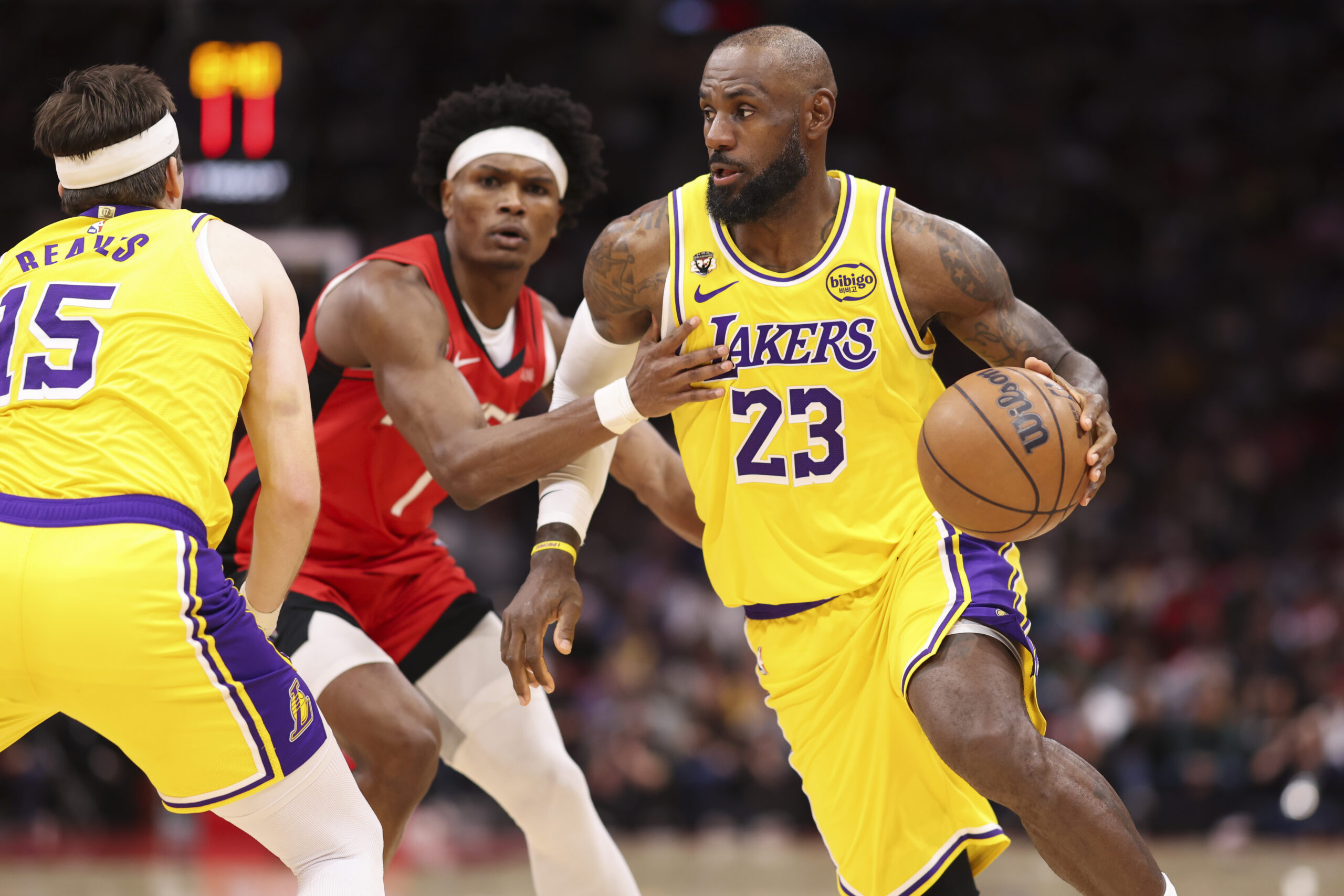 Mar 16, 2026; Houston, Texas, USA; Los Angeles Lakers forward LeBron James (23) dribbles with the ball around Houston Rockets guard Amen Thompson (1) during the third quarter at Toyota Center. Mandatory Credit: Troy Taormina-Imagn Images