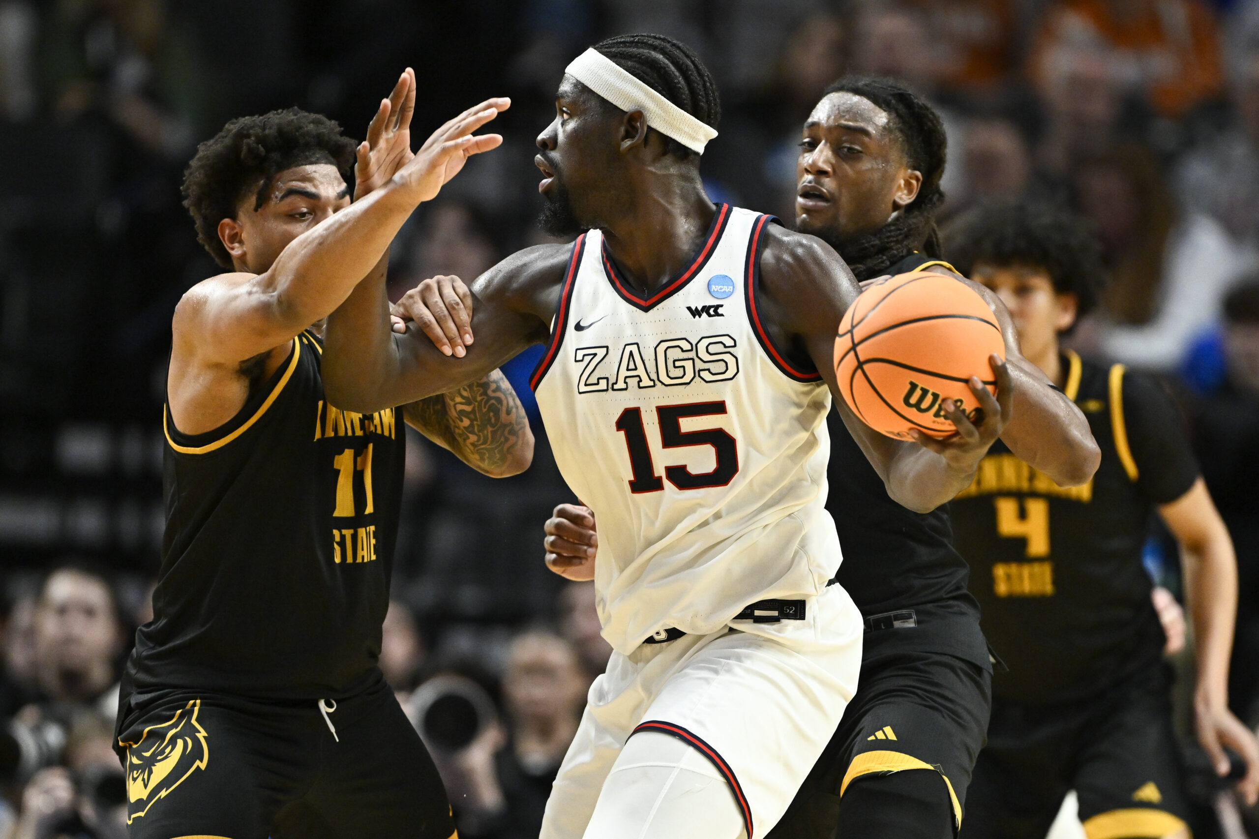 Mar 19, 2026; Portland, OR, USA; Kennesaw State Owls guard RJ Johnson (11) defends against Gonzaga Bulldogs forward Graham Ike (15) during the first half of a first round game of the men's 2026 NCAA Tournament at Moda Center. Mandatory Credit: Craig Strobeck-Imagn Images