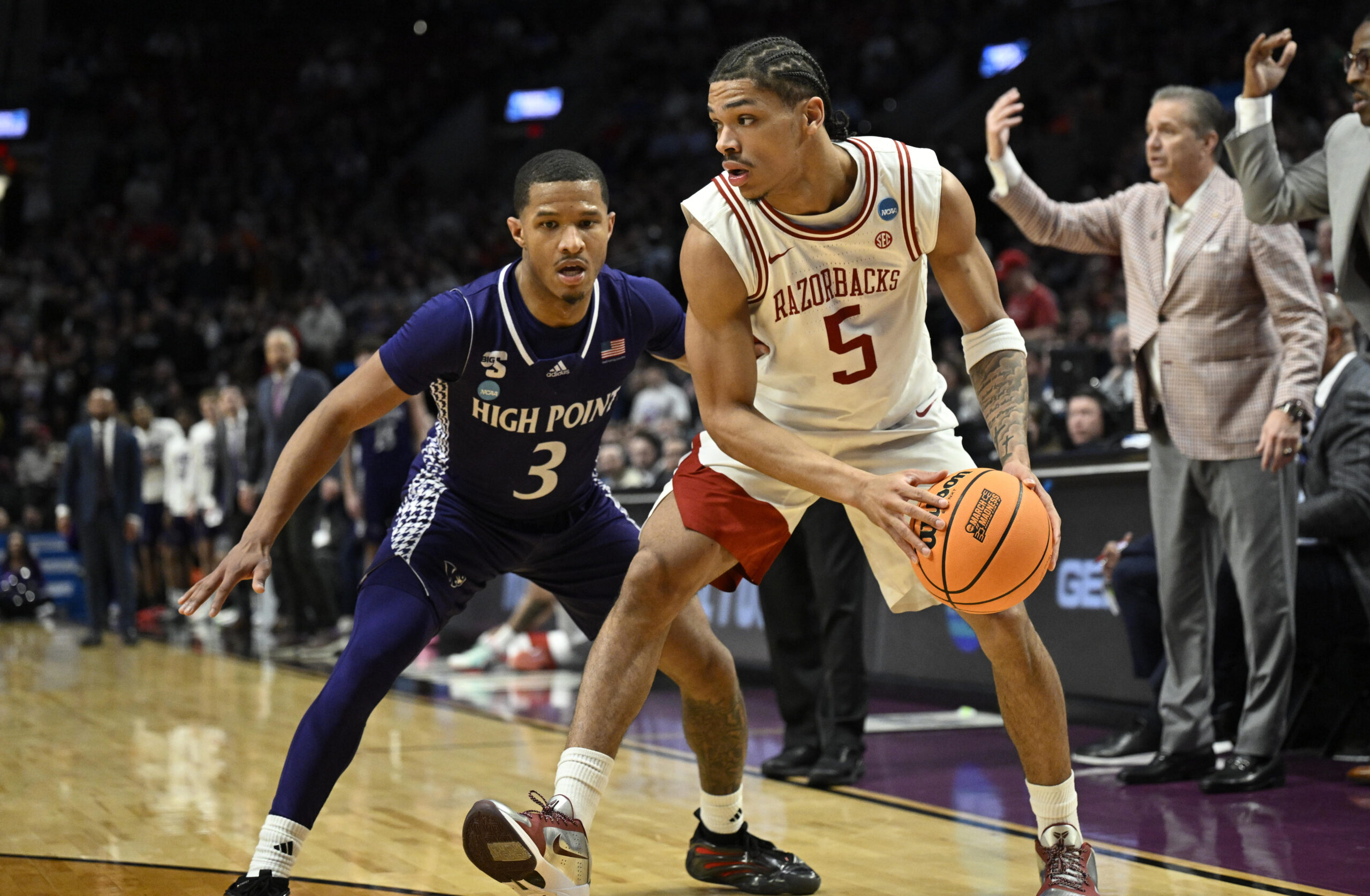 Mar 21, 2026; Portland, OR, USA; Arkansas Razorbacks guard Darius Acuff Jr. (5) drives against High Point Panthers guard Rob Martin (3) in the second half during a second round game of the men's 2026 NCAA Tournament at Moda Center. Mandatory Credit: Troy Wayrynen-Imagn Images