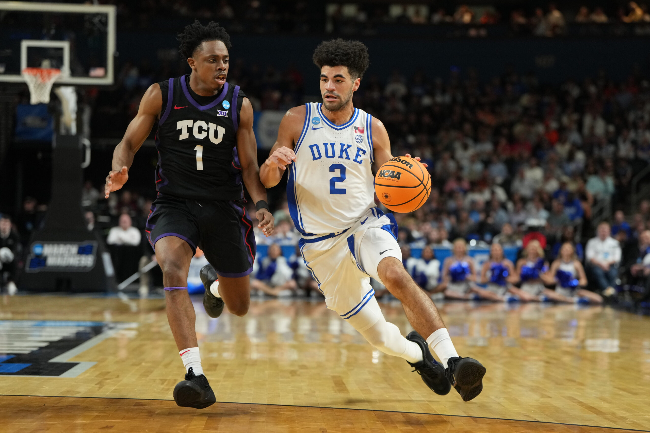 Mar 21, 2026; Greenville, SC, USA;  Duke Blue Devils guard Cayden Boozer (2) with the ball as Texas Christian University Horned Frogs guard Jayden Pierre (1) defends in the first half during a second round game of the men's 2026 NCAA Tournament at Bon Secours Wellness Arena. Mandatory Credit: Bob Donnan-Imagn Images