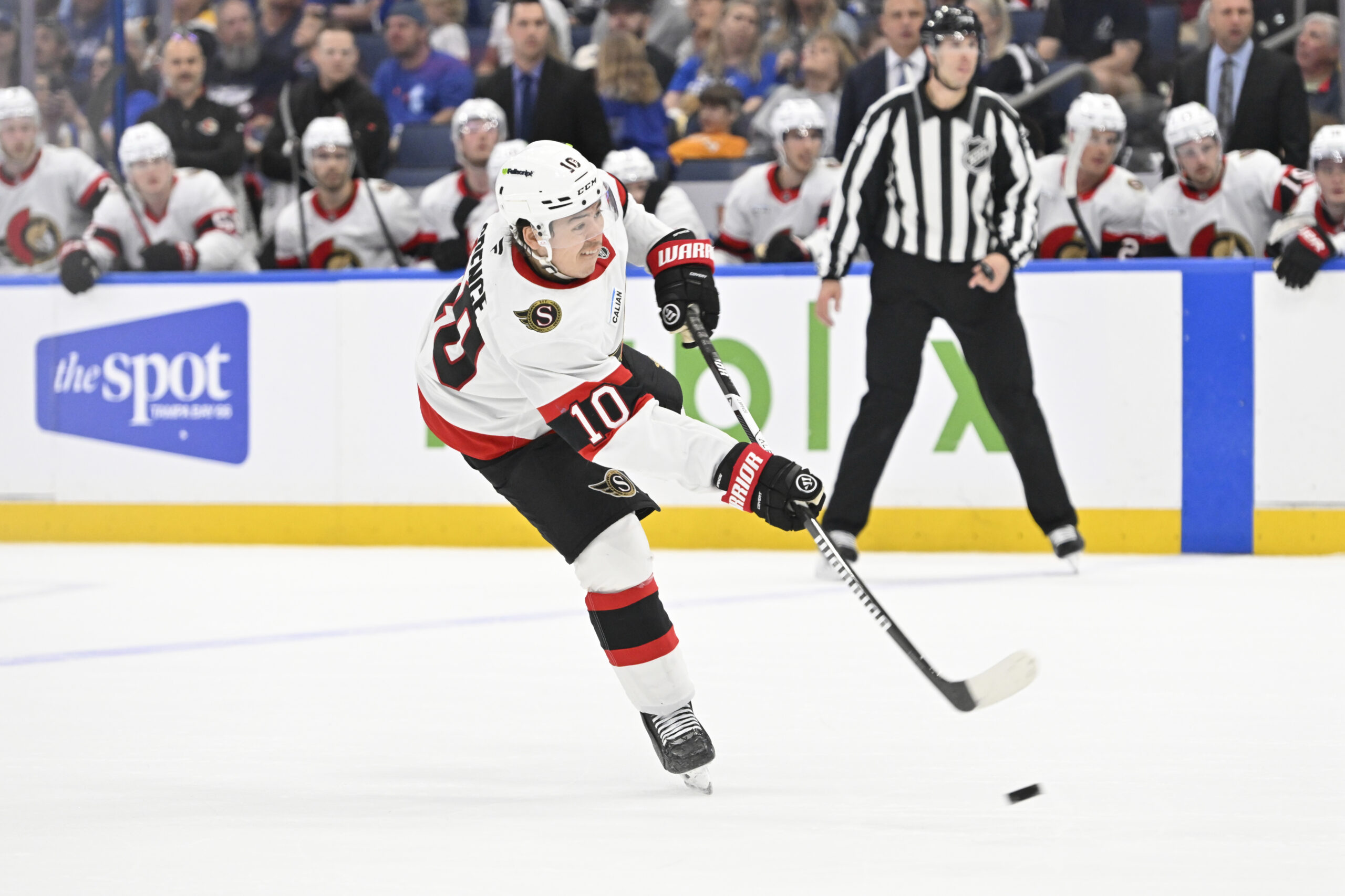 Mar 28, 2026; Tampa, Florida, USA; Ottawa Senators defenseman Jordan Spence (10) attempts a shot during the second period against Tampa Bay Lightning at Benchmark International Arena. Mandatory Credit: Pablo Robles-Imagn Images