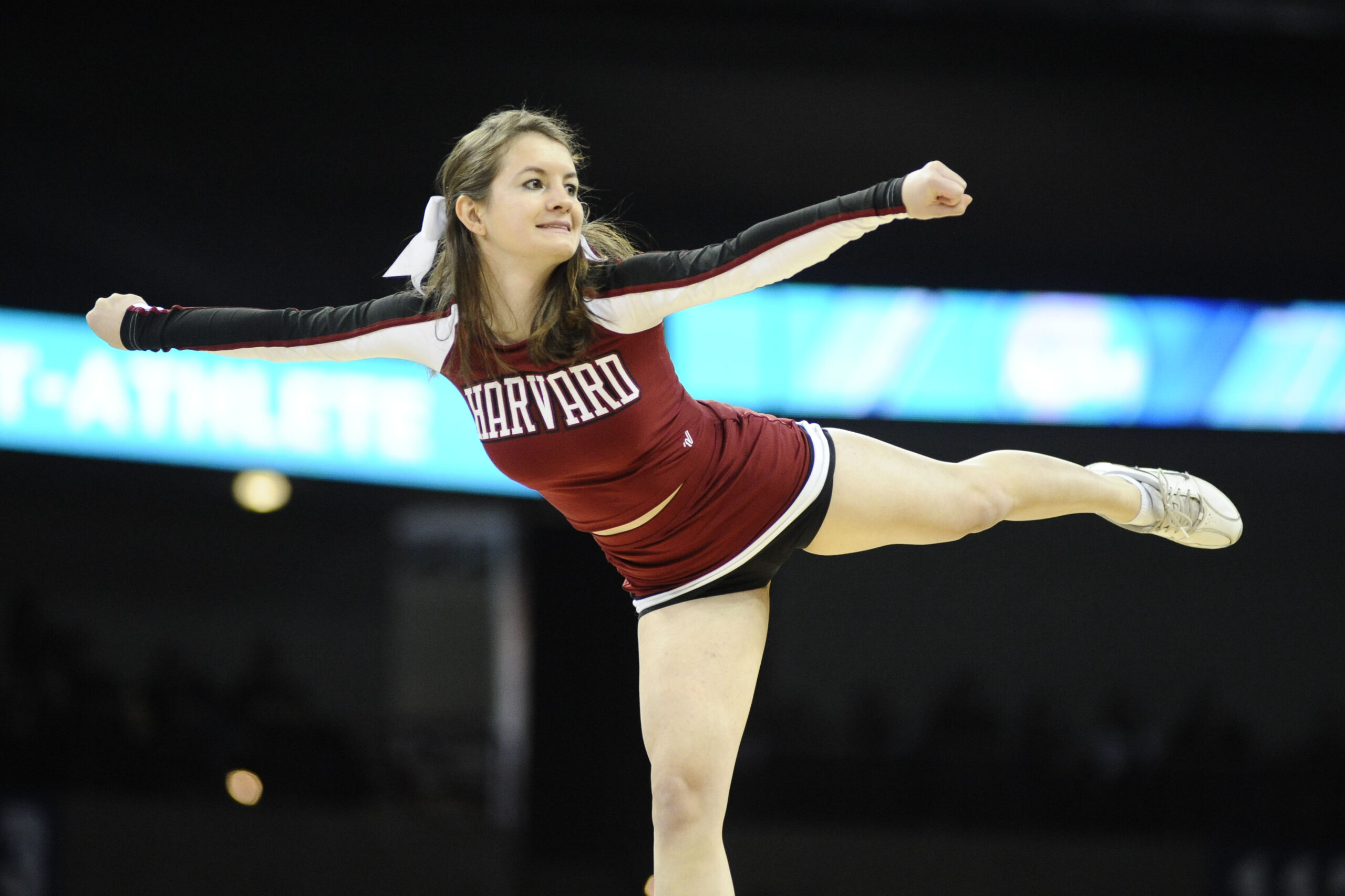 Mar 20, 2014; Spokane, WA, USA; Harvard Crimson cheerleader performs in the first half of a men's college basketball game during the second round of the 2014 NCAA Tournament against the Cincinnati Bearcats at Veterans Memorial Arena. Mandatory Credit: James Snook-Imagn Images